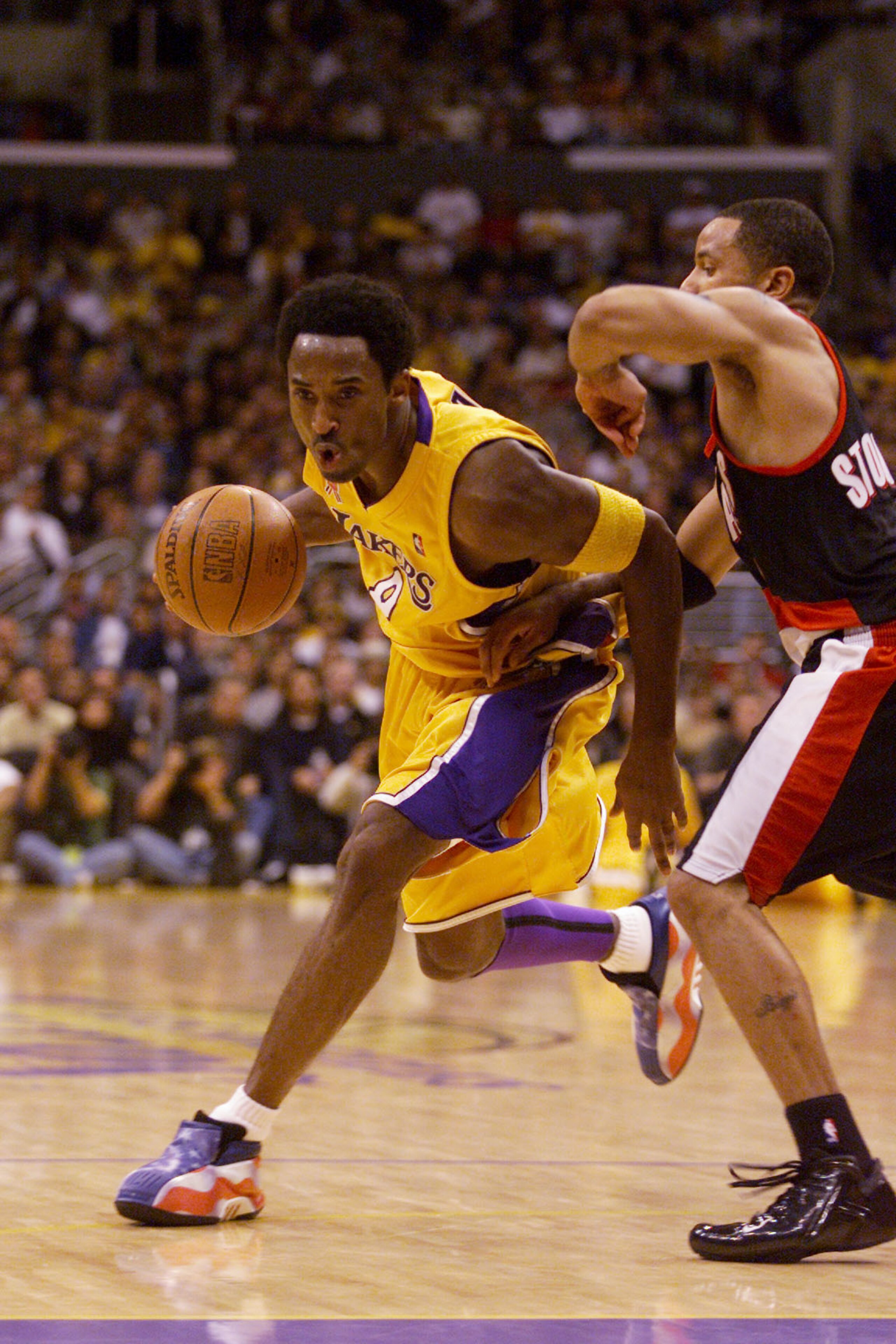 30 Oct 2001: Kobe Bryant #8 of the Los Angeles Lakers drives the ball around Damon Stoudamire #3 of the Portland Trailblazers during their game at Staples Center in Los Angeles, California. The Lakers won 98-87. DIGITAL IMAGE Mandatory Credit: Adam P 30 Oct 2001: Kobe Bryant #8 of the Los Angeles Lakers drives the ball around Damon Stoudamire #3 of the Portland Trailblazers during their game at Staples Center in Los Angeles, California. The Lakers won 98-87. DIGITAL IMAGE Mandatory Credit: Adam P