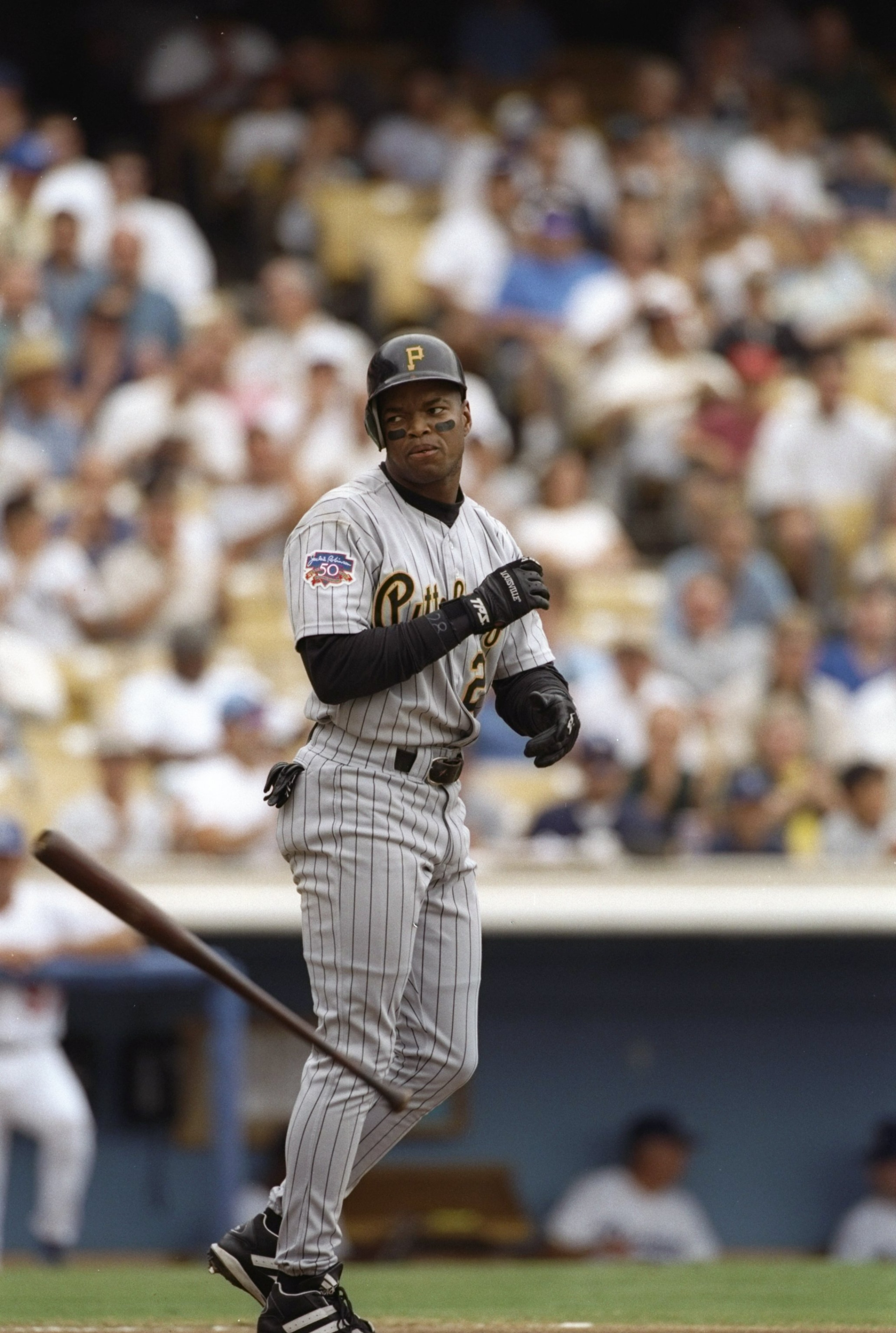 27 Jul 1997:  Left fielder Al Martin of the Pittsburgh Pirates throws his bat during a game against the Los Angeles Dodgers at Dodger Stadium in Los Angeles, California.  The Dodgers won the game 3-1. Mandatory Credit: Elsa Hasch  /Allsport