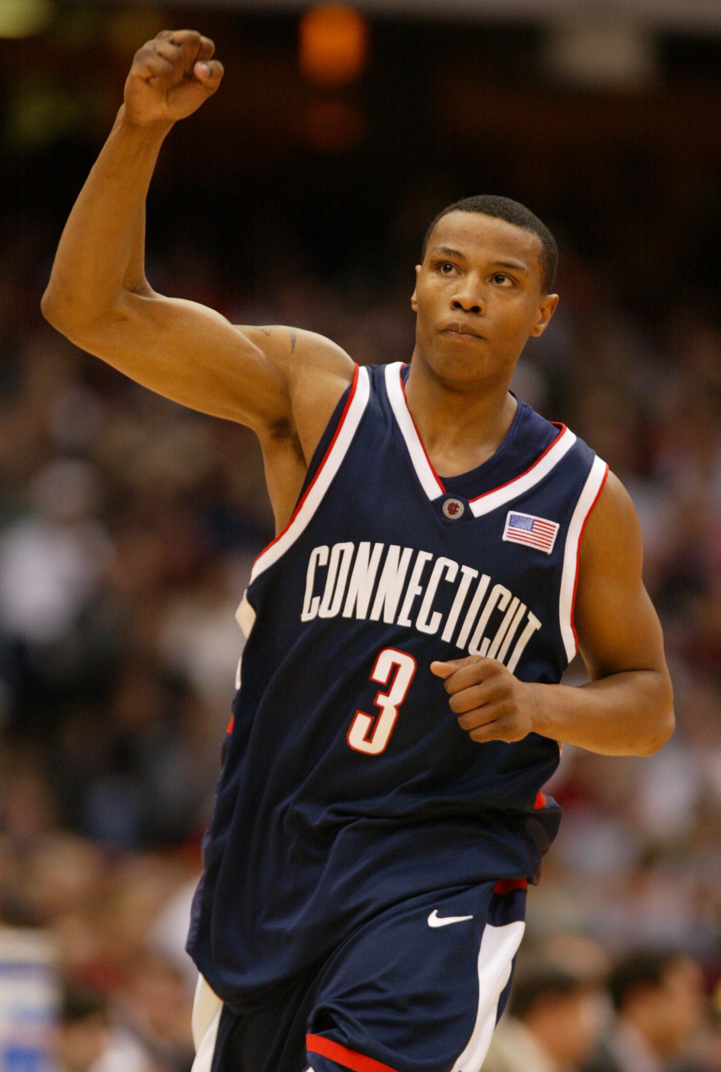 24 Mar 2002:  Caron Butler #3 of Connecticut raises his hand after a point against Maryland during the East Regional Semifinal at the Carrier Dome in Syracuse, New York. Digital Image Mandatory Credit: Al Bello/Getty Images