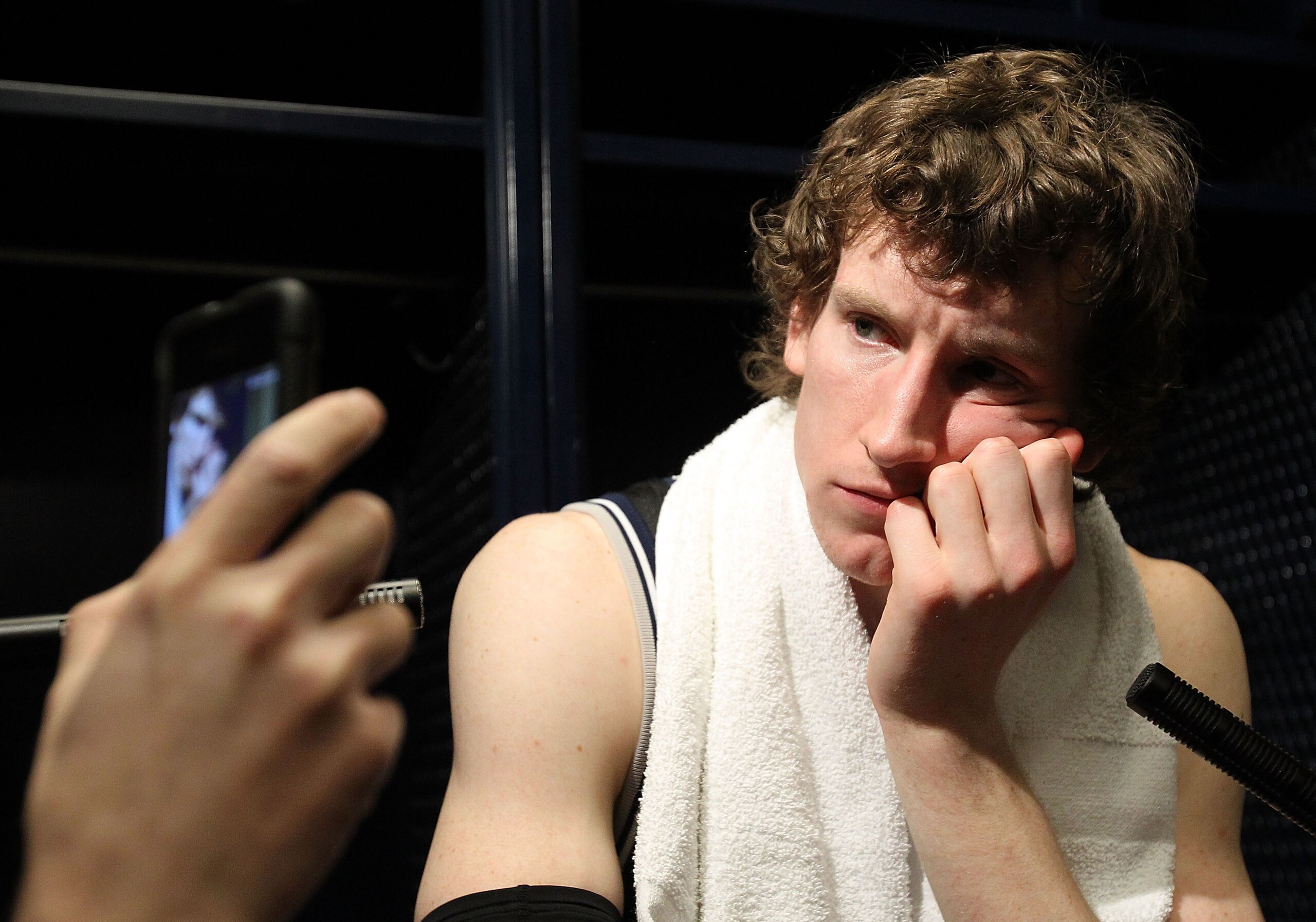 HOUSTON, TX - APRIL 04:  Matt Howard #54 of the Butler Bulldogs talks to the media after losing to the Connecticut Huskies in the National Championship Game of the 2011 NCAA Division I Men's Basketball Tournament at Reliant Stadium on April 4, 2011 in Hou