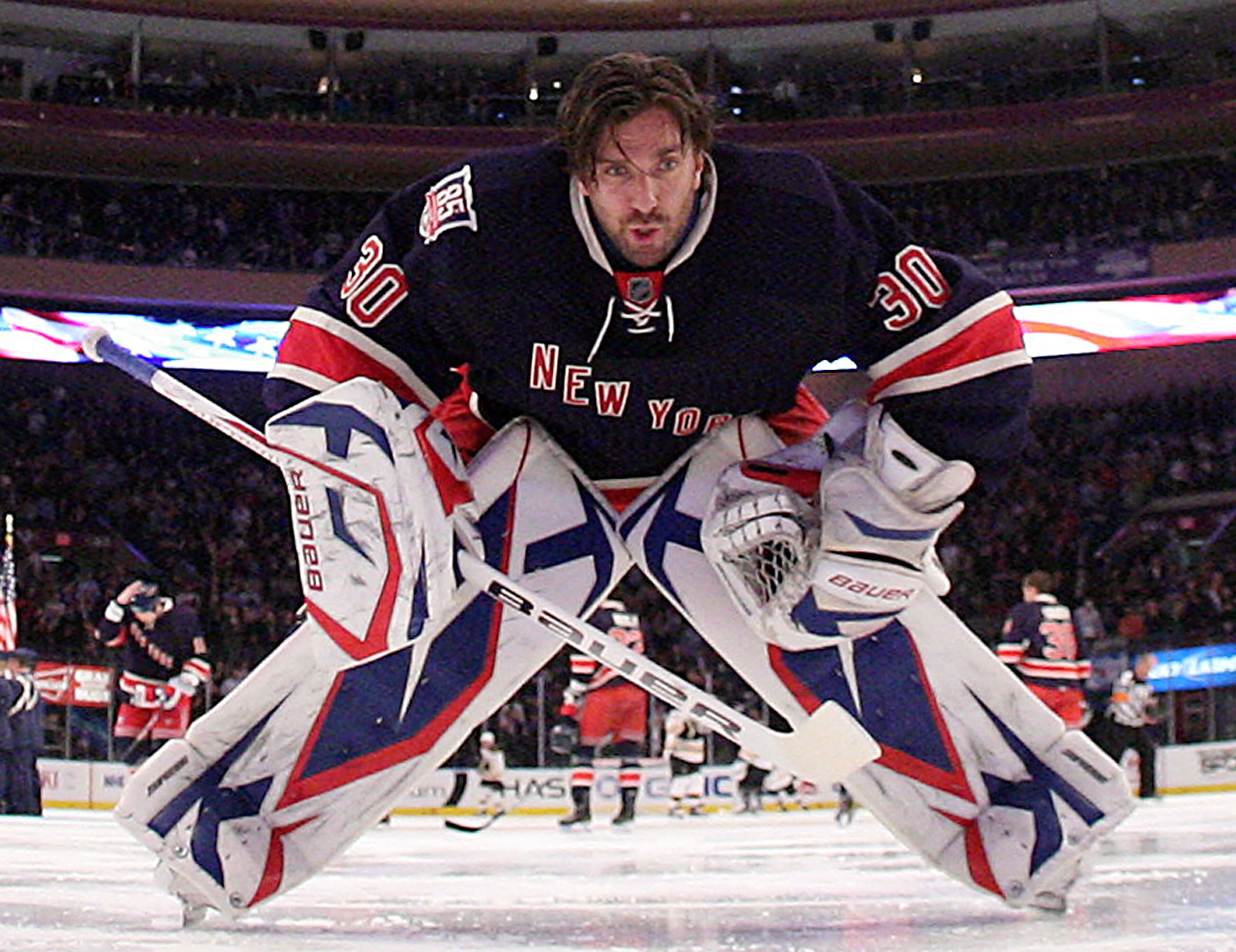 NEW YORK, NY - APRIL 04:  Henrik Lundqvist #30 of the New York Rangers gets set for the opening faceoff against the Boston Bruins at Madison Square Garden on April 4, 2011 in New York City. The Rangers defeated the Bruins 5-3.  (Photo by Bruce Bennett/Get