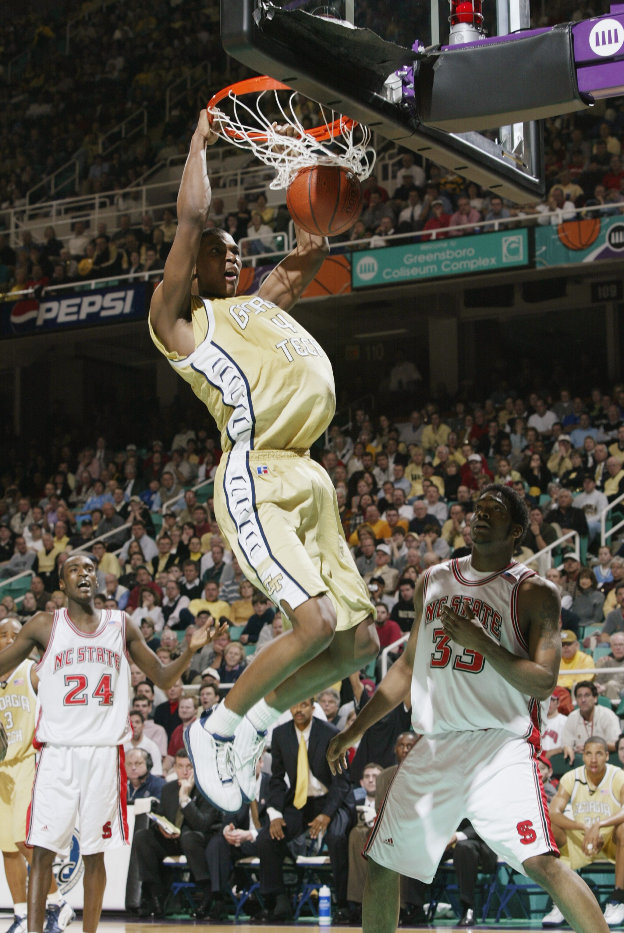 GREENSBORO, NC - MARCH 14:   Chris Bosh #4 of Georgia Tech makes a slam dunk during the quarter final game of the ACC Tournament against North Carolina State on March 14, 2003 at the Greensboro Coliseum in Greensboro, North Carolina.  Georgia Tech defeate
