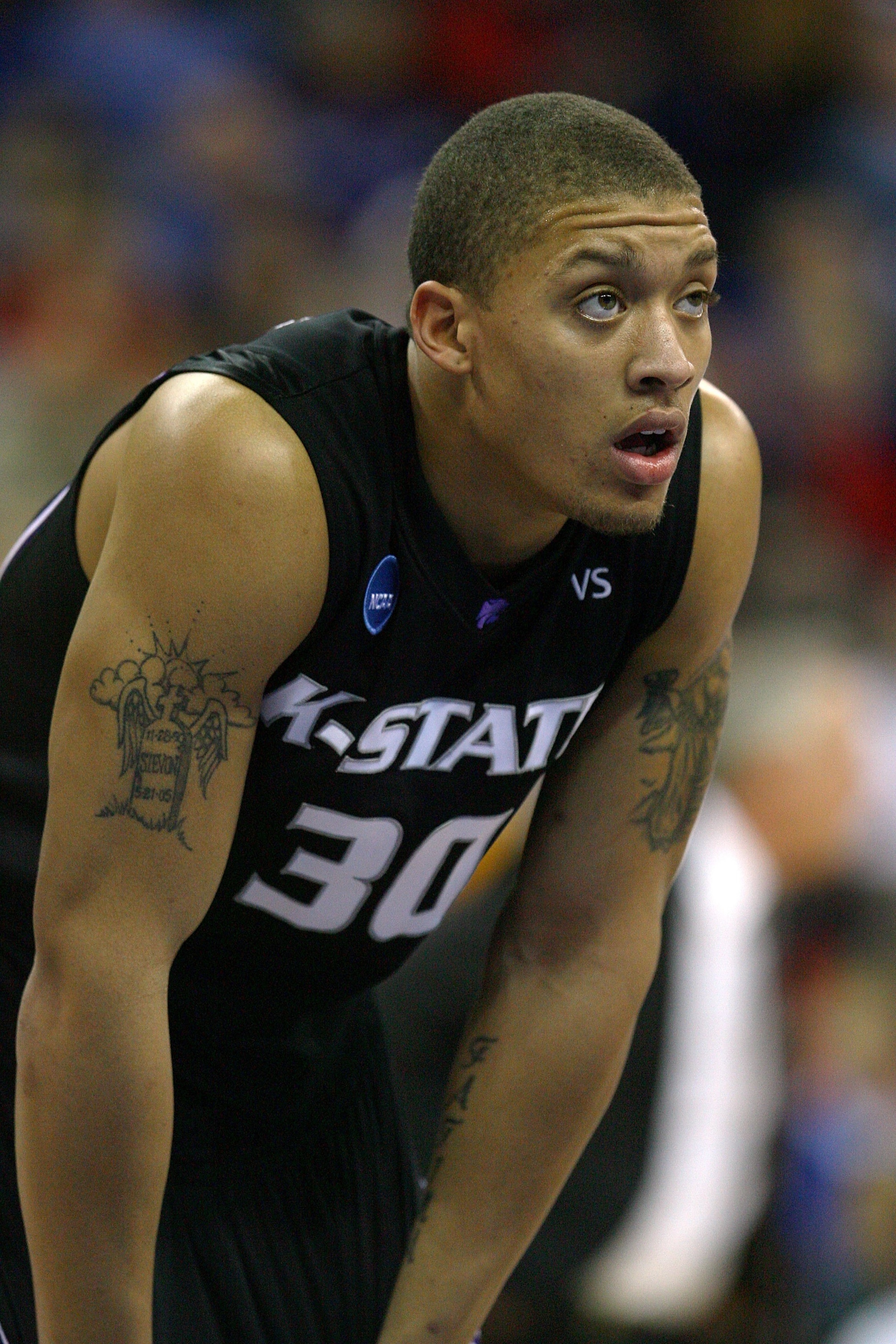OMAHA, NE - MARCH 22: Michael Beasley #30 of the Kansas State Wildcats looks on against the Wisconsin Badgers during the Midwest Region second round of the 2008 NCAA Men's Basketball Tournament on March 22, 2008 at the Qwest Center in Omaha, Nebraska. Ka OMAHA, NE - MARCH 22: Michael Beasley #30 of the Kansas State Wildcats looks on against the Wisconsin Badgers during the Midwest Region second round of the 2008 NCAA Men's Basketball Tournament on March 22, 2008 at the Qwest Center in Omaha, Nebraska. Ka