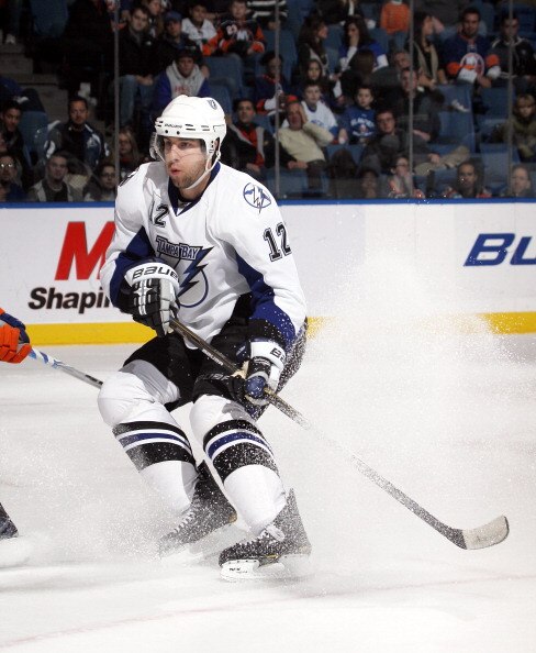 UNIONDALE, NY - DECEMBER 22:  Simon Gagne #12 of the Tampa Bay Lightning skates against the New York Islanders at the Nassau Coliseum on December 22, 2010 in Uniondale, New York.  (Photo by Bruce Bennett/Getty Images)