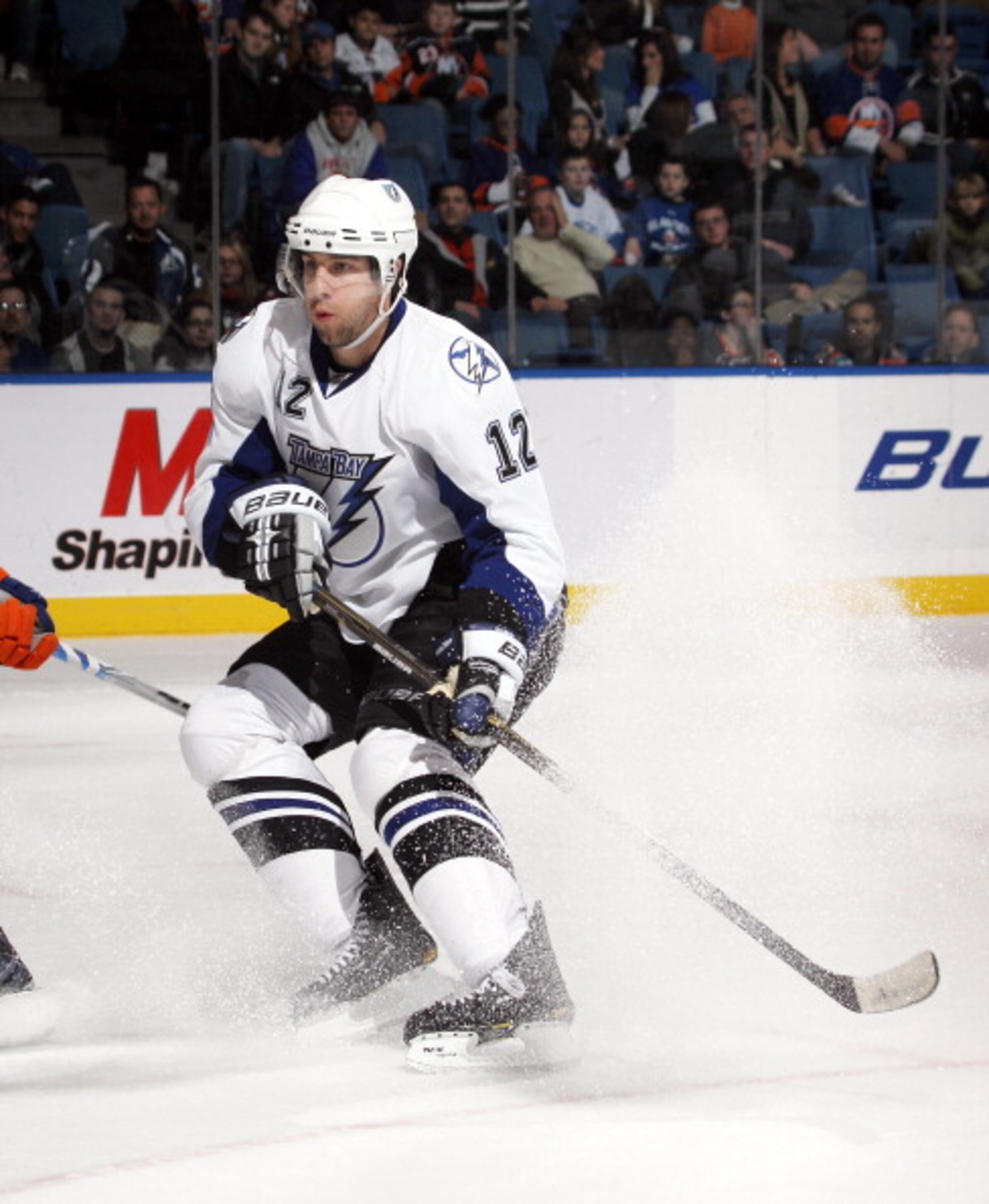 UNIONDALE, NY - DECEMBER 22:  Simon Gagne #12 of the Tampa Bay Lightning skates against the New York Islanders at the Nassau Coliseum on December 22, 2010 in Uniondale, New York.  (Photo by Bruce Bennett/Getty Images)