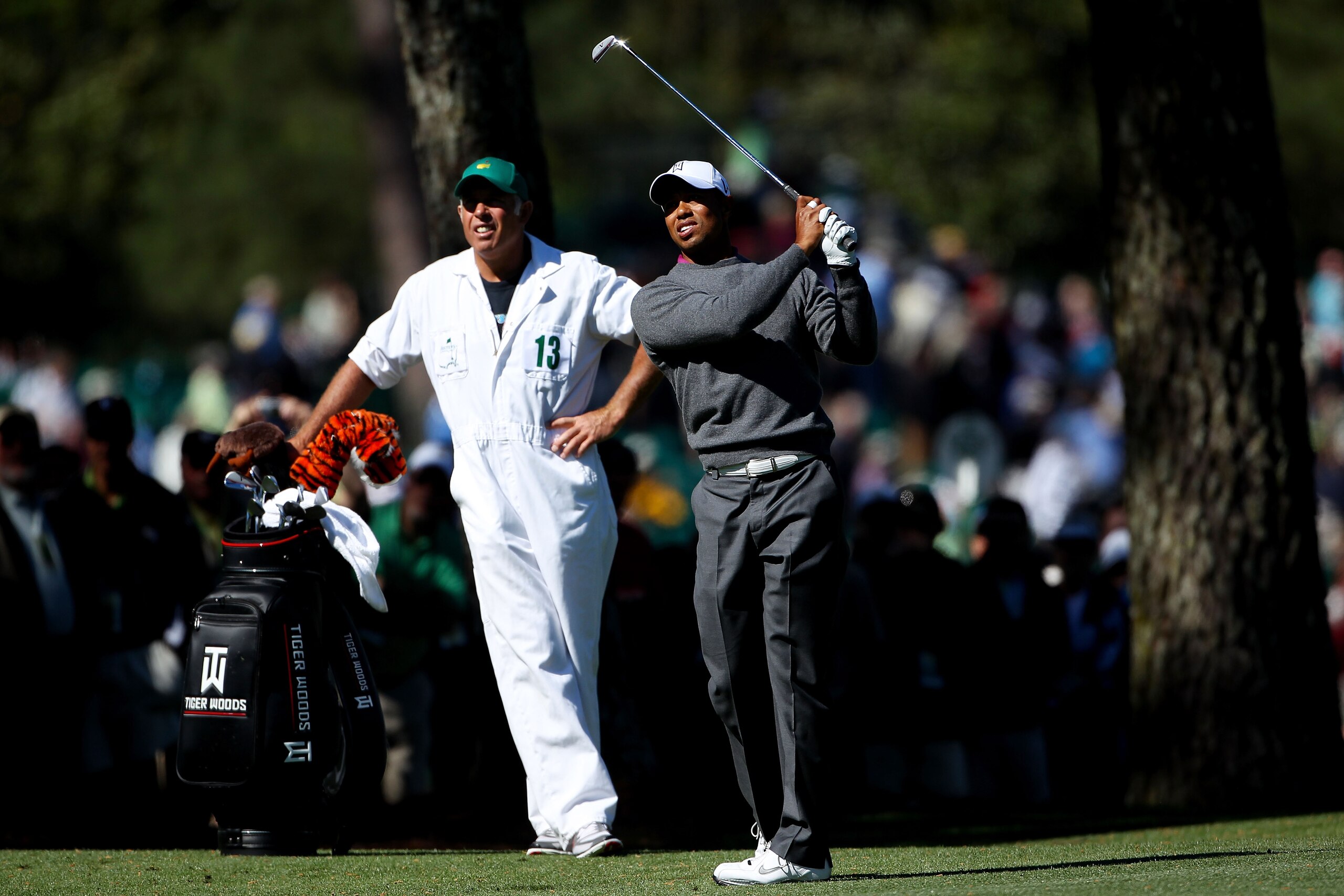 AUGUSTA, GA - APRIL 06:  Tiger Woods hits a shot as his caddie Steve Williams looks on during a practice round prior to the 2011 Masters Tournament at Augusta National Golf Club on April 6, 2011 in Augusta, Georgia.  (Photo by Andrew Redington/Getty Image