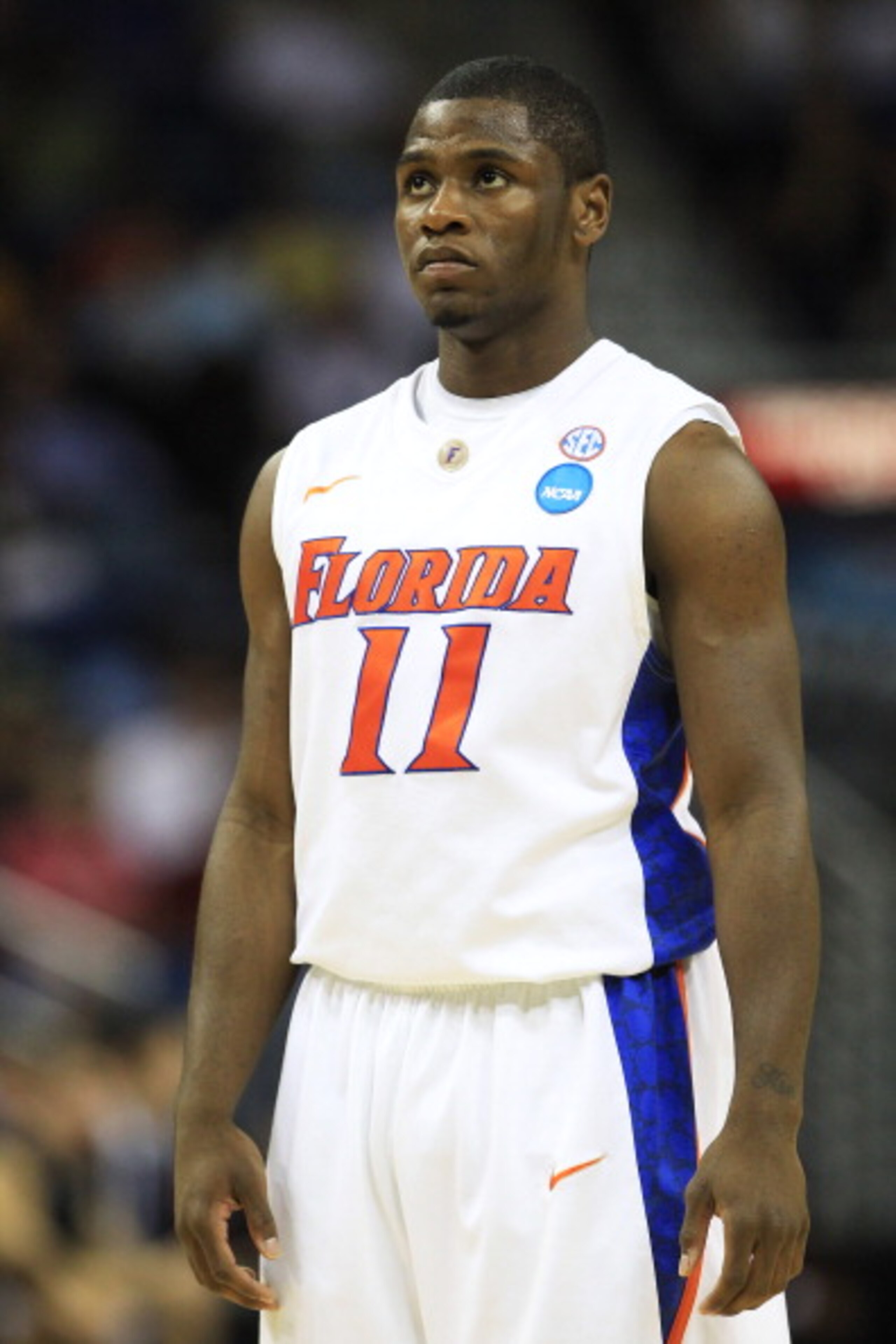 NEW ORLEANS, LA - MARCH 26:  Erving Walker #11 of the Florida Gators reacts during their game against the Butler Bulldogs in the Southeast regional final of the 2011 NCAA men's basketball tournament at New Orleans Arena on March 26, 2011 in New Orleans, L