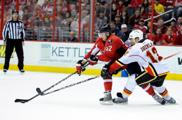 WASHINGTON - MARCH 28:  Mike Green #52 of the Washington Capitals handles the puck against Jarome Iginla #12 of the Calgary Flames at the Verizon Center on March 28, 2010 in Washington, DC.  (Photo by Greg Fiume/Getty Images)