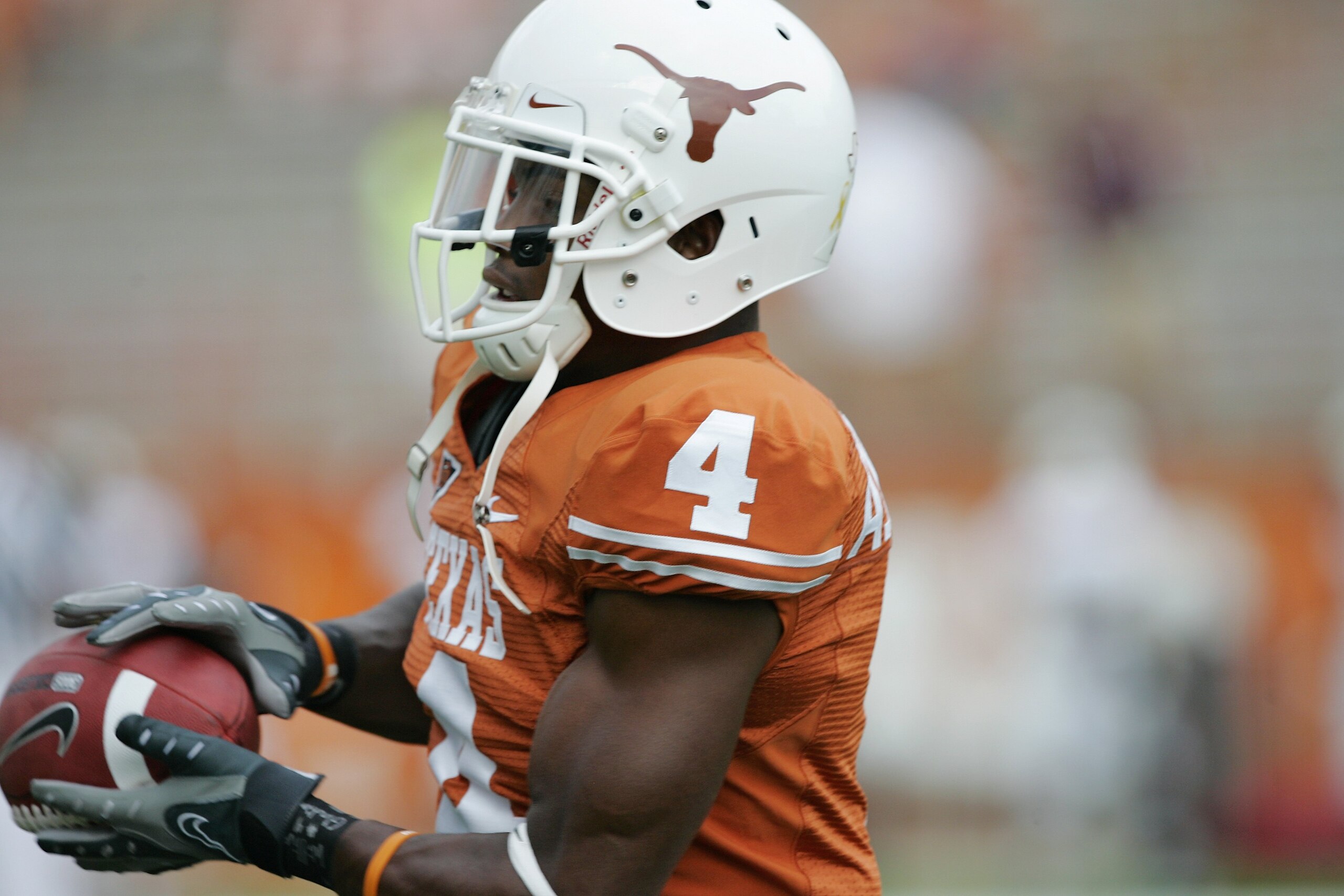 AUSTIN, TX - SEPTEMBER 5:  Defensive back Aaron Williams #4 of the Texas Longhorns catches the ball during warm-up prior to their game against the Louisiana Monroe Warhawks on September 5, 2009 at Darrell K Royal-Texas Memorial Stadium in Austin, Texas. T