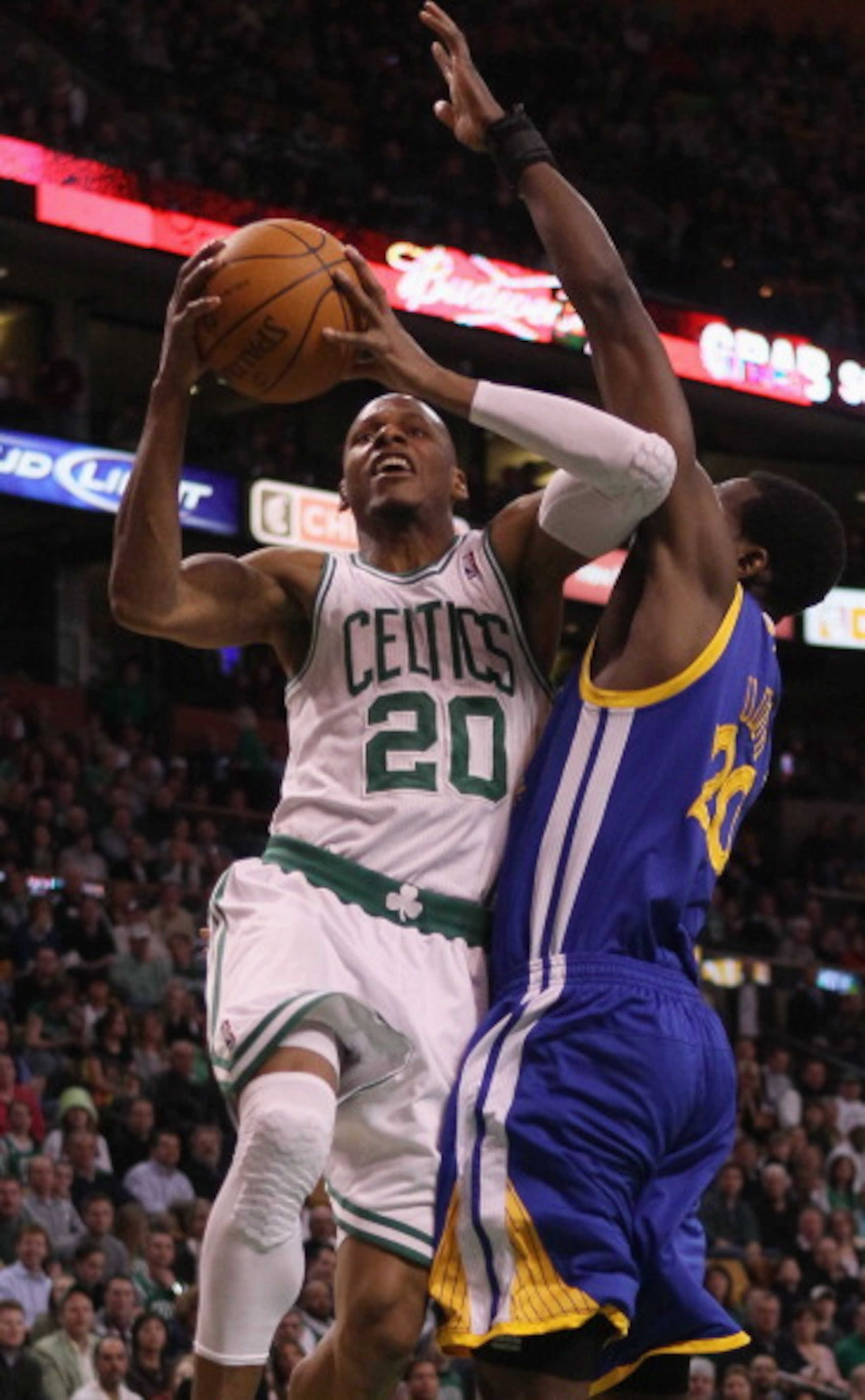 BOSTON, MA - MARCH 04: Ray Allen #20 of the Boston Celtics takes a shot as Ekpe Udoh #20 of the Golden State Warriors defends on March 4, 2011 at the TD Garden in Boston, Massachusetts. NOTE TO USER: User expressly acknowledges and agrees that, by downl BOSTON, MA - MARCH 04: Ray Allen #20 of the Boston Celtics takes a shot as Ekpe Udoh #20 of the Golden State Warriors defends on March 4, 2011 at the TD Garden in Boston, Massachusetts. NOTE TO USER: User expressly acknowledges and agrees that, by downl