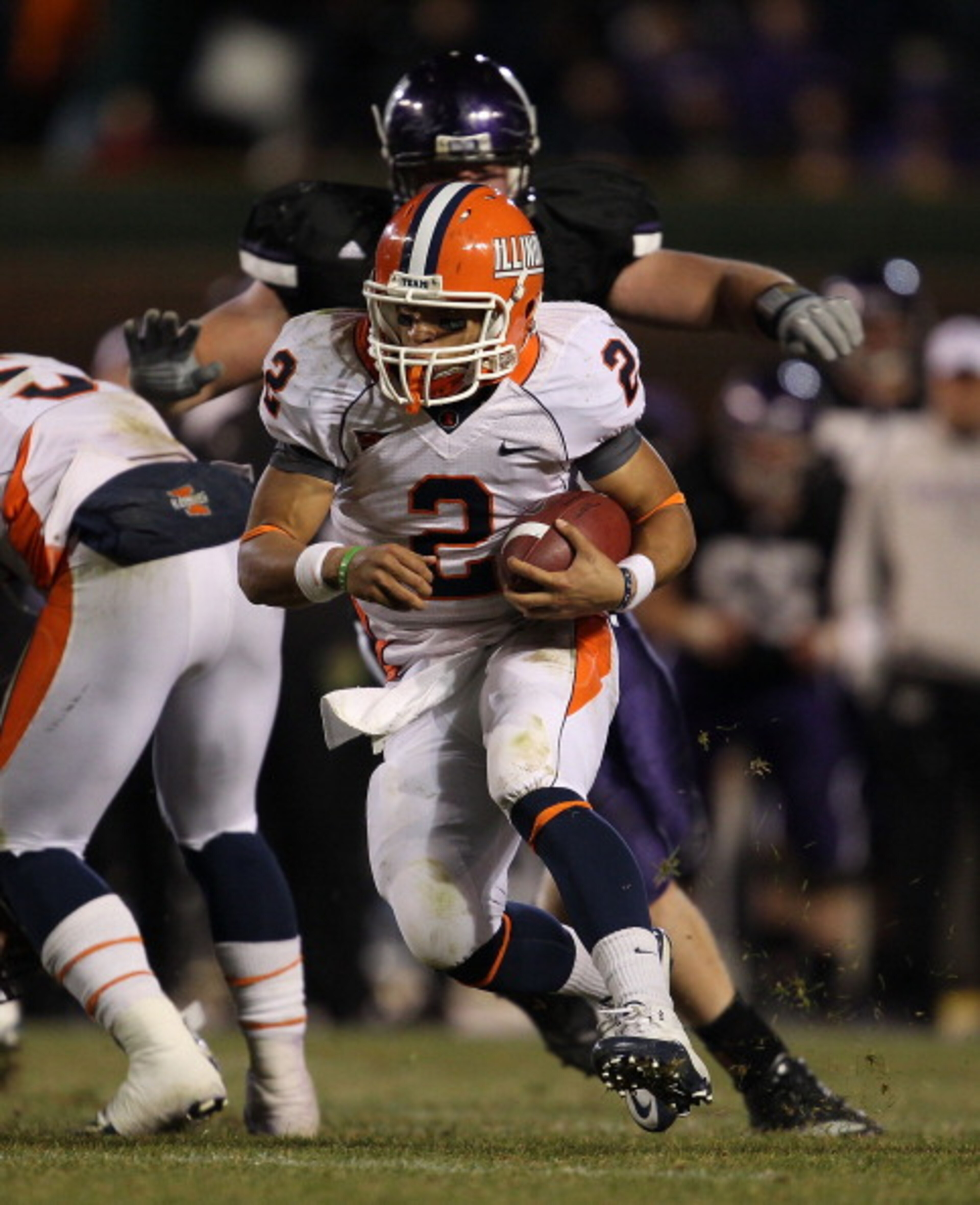 CHICAGO - NOVEMBER 20: Nathan Scheelhasse #2 of the Illinois Fighting Illini runs against the Northwestern Wildcats during a game played at Wrigley Field on November 20, 2010 in Chicago, Illinois. Illinois defeated Northwestern 48-27. (Photo by Jonathan D