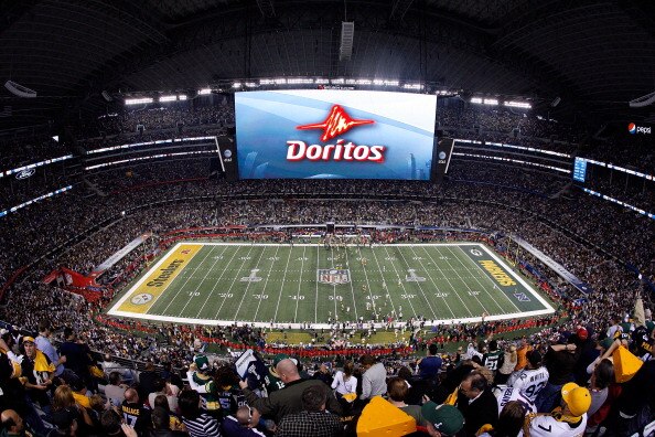 ARLINGTON, TX - FEBRUARY 06:  A Doritos ad is displayed on the screen during Super Bowl XLV at Cowboys Stadium on February 6, 2011 in Arlington, Texas.  (Photo by Tom Pennington/Getty Images)