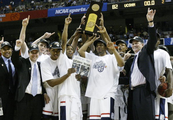 SAN ANTONIO - APRIL 5:  The UConn Huskies celebrate with the trophy after defeating the Georgia Tech Yellow Jackets 82-73 during the National Championship game of the NCAA Men's Final Four Tournament at the Alamodome on April 5, 2004 in San Antonio, Texas
