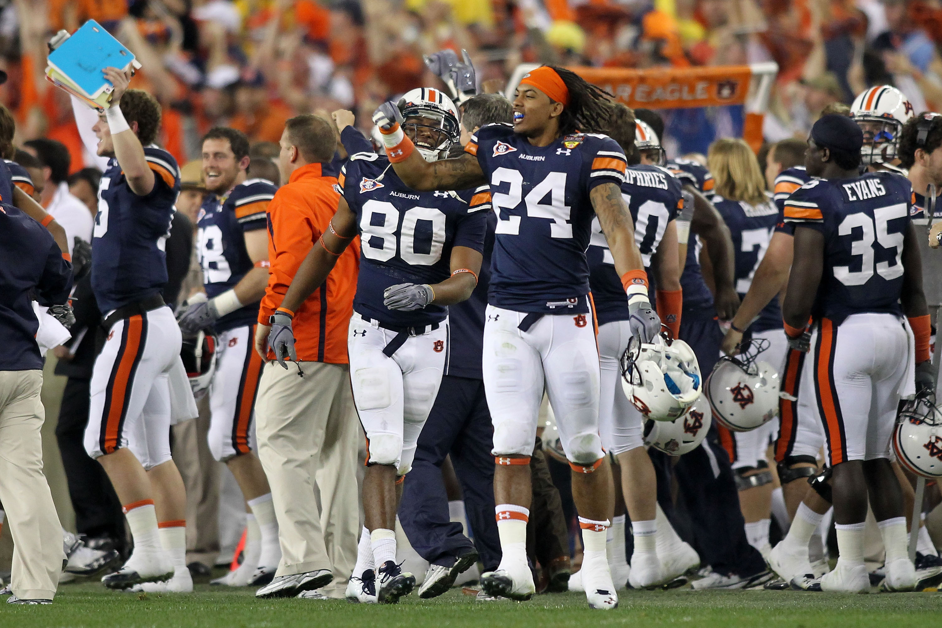 GLENDALE, AZ - JANUARY 10:  Emory Blake #80 and Ryan Smith #24 of the Auburn Tigers celebrate on the sideline against the Oregon Ducks during the Tostitos BCS National Championship Game at University of Phoenix Stadium on January 10, 2011 in Glendale, Ari