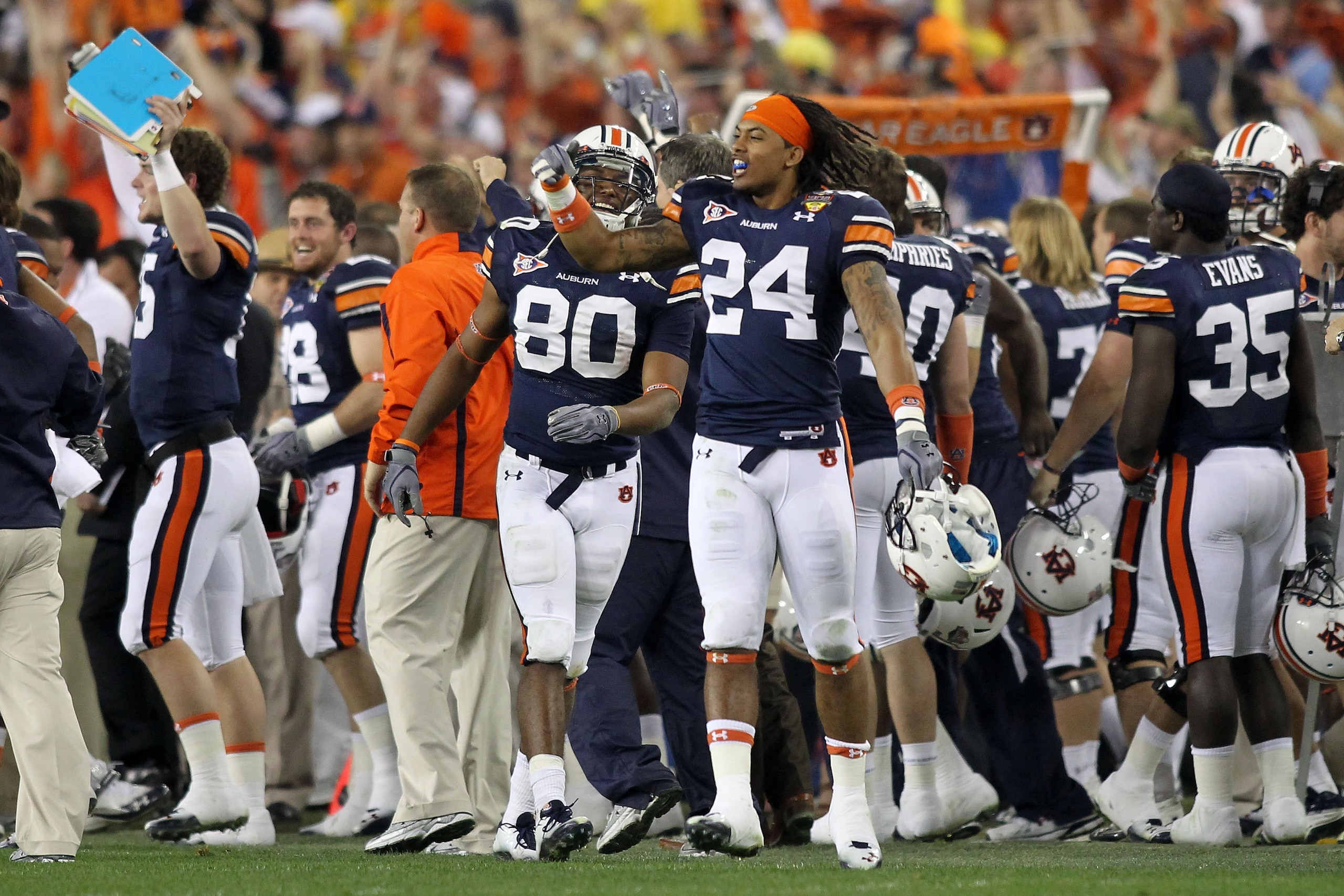 GLENDALE, AZ - JANUARY 10: Emory Blake #80 and Ryan Smith #24 of the Auburn Tigers celebrate on the sideline against the Oregon Ducks during the Tostitos BCS National Championship Game at University of Phoenix Stadium on January 10, 2011 in Glendale, Ari GLENDALE, AZ - JANUARY 10: Emory Blake #80 and Ryan Smith #24 of the Auburn Tigers celebrate on the sideline against the Oregon Ducks during the Tostitos BCS National Championship Game at University of Phoenix Stadium on January 10, 2011 in Glendale, Ari