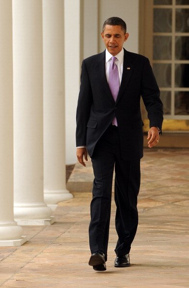 WASHINGTON, DC - JANUARY 25:  (AFP OUT) U.S. President Barack Obama walks through the Colonnade of the Rose Garden of the White House on January 25, 2011 in Washington, DC. Later this evening Obama will give his State of the Union Address to the Joint Ses