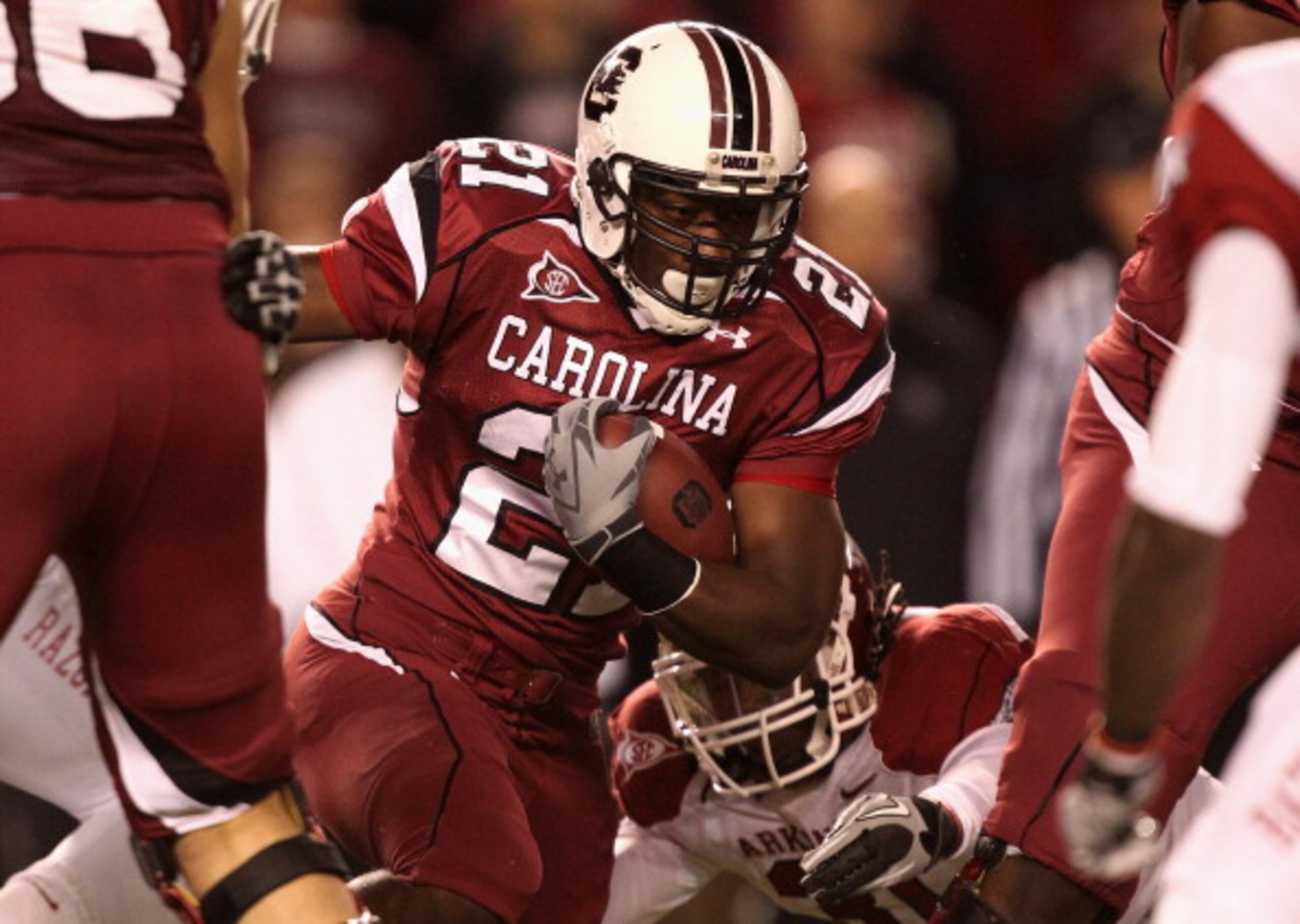 COLUMBIA, SC - NOVEMBER 06:  Jerico Nelson #31 of the Arkansas Razorbacks tries to stop Marcus Lattimore #21 of the South Carolina Gamecocks during their game at Williams-Brice Stadium on November 6, 2010 in Columbia, South Carolina.  (Photo by Streeter L