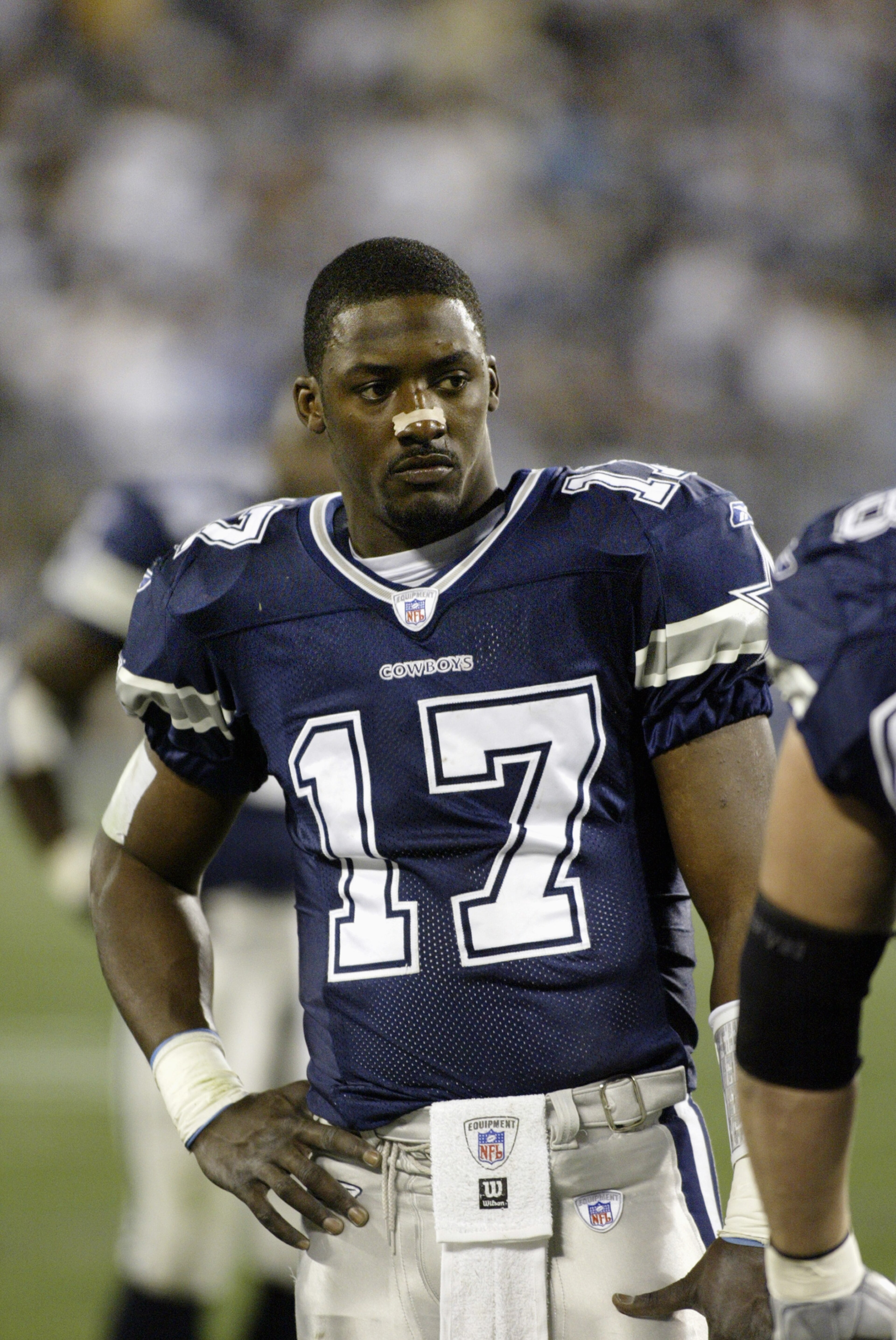 CHARLOTTE, NC - JANUARY 3:  Quarterback Quincy Carter #17 of the Dallas Cowboys rests on the sidelines during the NFC Wildcard playoff game against the Carolina Panthers at Ericsson Stadium on January 3, 2004 in Charlotte, North Carolina.  The Panthers de