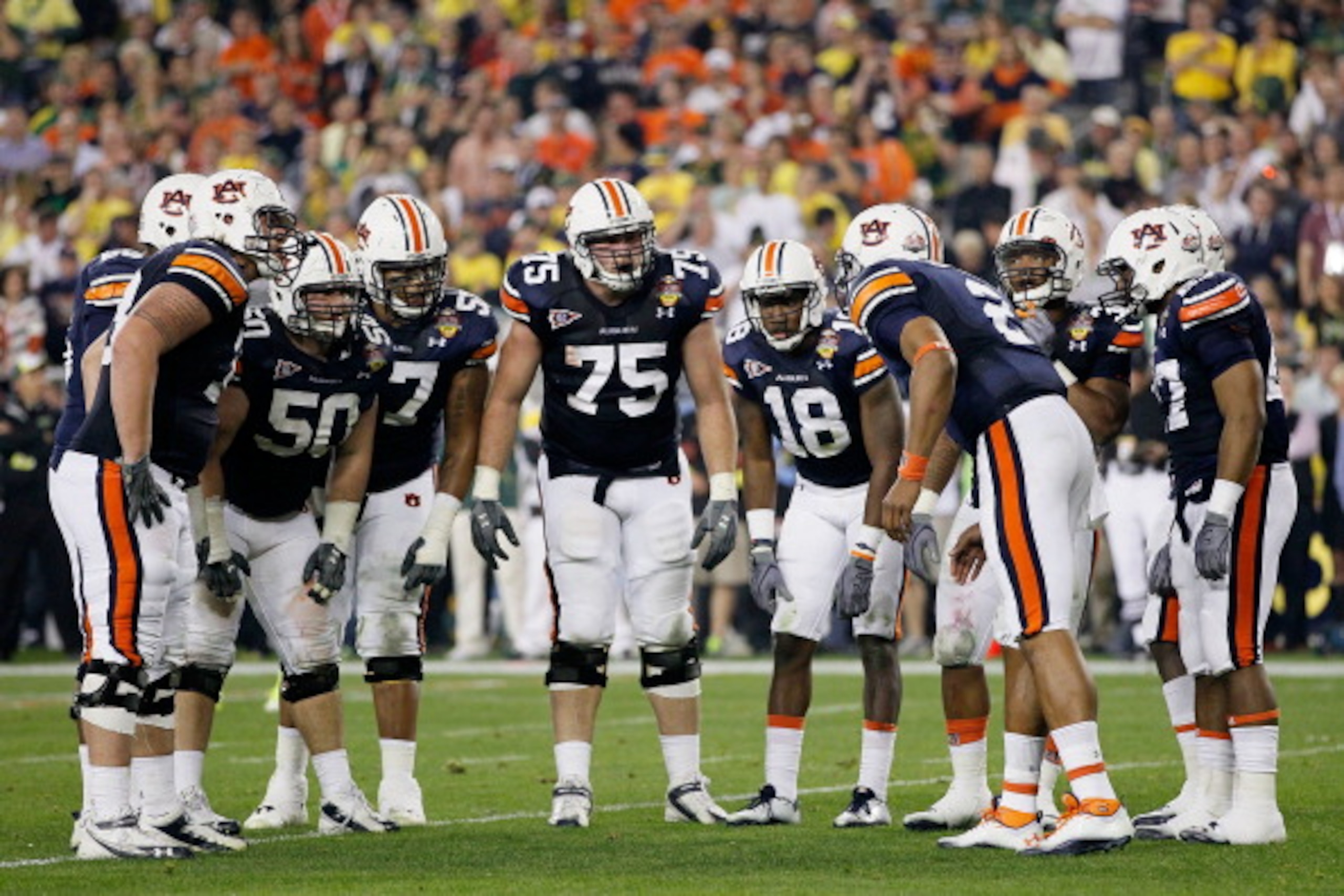 GLENDALE, AZ - JANUARY 10: The Auburn Tigers huddle against the Oregon Ducks during the Tostitos BCS National Championship Game at University of Phoenix Stadium on January 10, 2011 in Glendale, Arizona. (Photo by Kevin C. Cox/Getty Images) GLENDALE, AZ - JANUARY 10: The Auburn Tigers huddle against the Oregon Ducks during the Tostitos BCS National Championship Game at University of Phoenix Stadium on January 10, 2011 in Glendale, Arizona. (Photo by Kevin C. Cox/Getty Images)