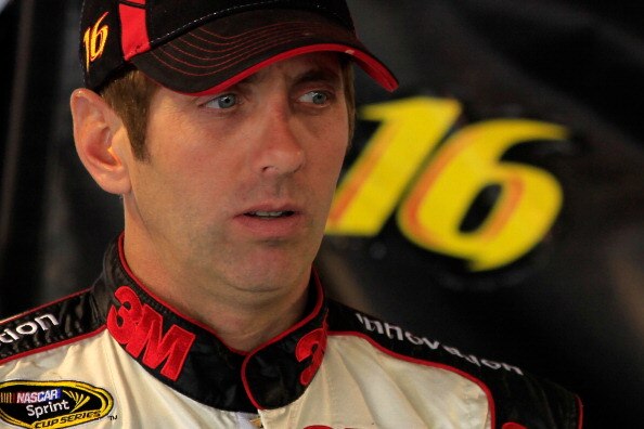 MARTINSVILLE, VA - APRIL 01:  Greg Biffle, driver of the #16 3M Ford, stands in the garage during practice for the NASCAR Sprint Cup Series Goody's Fast Relief 500 at Martinsville Speedway on April 1, 2011 in Martinsville, Virginia.  (Photo by Chris Trotm