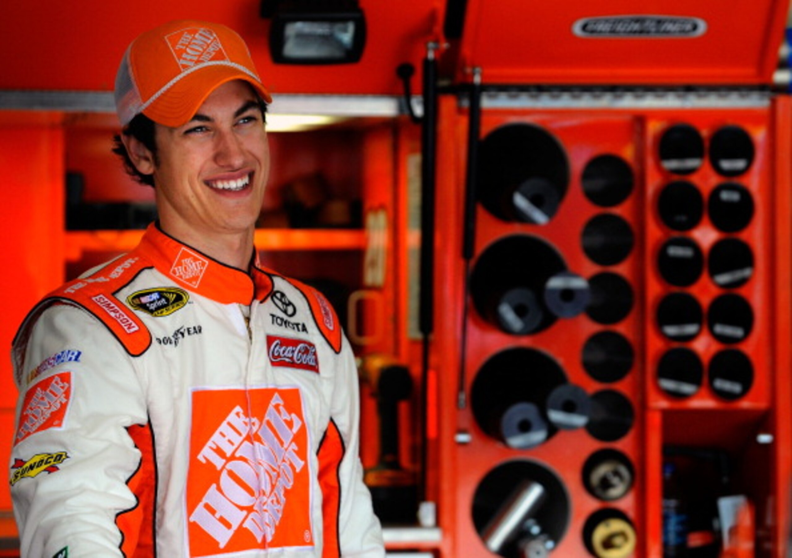 FONTANA, CA - MARCH 25:  Joey Logano, driver of the #20 The Home Depot Toyota, stands in the garage area during practice for the NASCAR Sprint Cup Series Auto Club 400 at Auto Club Speedway on March 25, 2011 in Fontana, California.  (Photo by Jared C. Til