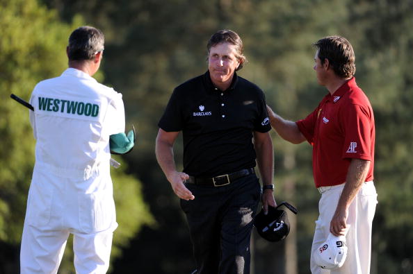 AUGUSTA, GA - APRIL 11:  Phil Mickelson (C) is congratulated on his three-stroke victory by Lee Westwood of England (R) and caddie Billy Foster (L) after the final round of the 2010 Masters Tournament at Augusta National Golf Club on April 11, 2010 in Aug