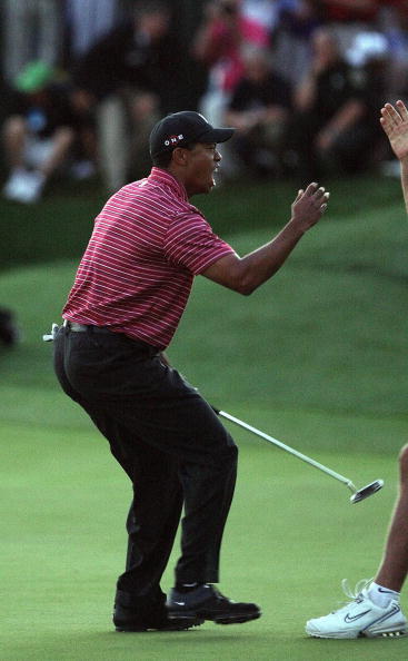 ORLANDO, FL - MARCH 29:  Tiger Woods of the USA holes for a winning birdie at the 18th hole during the final round of the Arnold Palmer Invitational Presented by Mastercard at the Bay Hill Club and Lodge on March 29, 2009 in Orlando, Florida  (Photo by Da