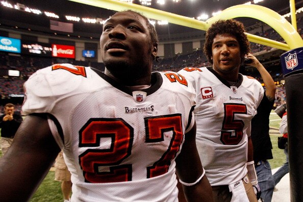 NEW ORLEANS, LA - JANUARY 02:  Quarterback Josh Freeman #5  celebrates with LeGarrette Blount #27 of the Tampa Bay Buccaneers after defeating the New Orleans Saints 23-13 at the Louisiana Superdome on January 2, 2011 in New Orleans, Louisiana.  (Photo by