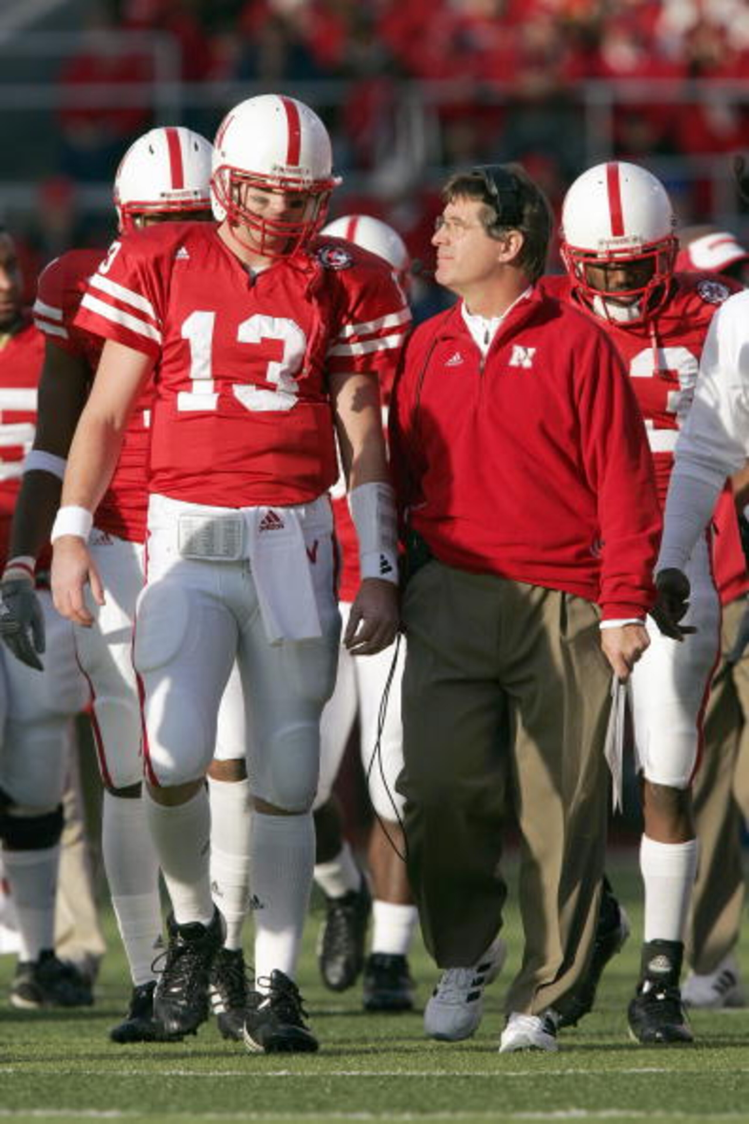 LINCOLN, NE - NOVEMBER 24: Quarterback Zac Taylor #13 of the Nebraska Cornhuskers listens to head coach Bill Callahan before the game against the Colorado Buffaloes on November 24, 2006 at Memorial Stadium in Lincoln, Nebraska. Nebraska won 37-14. (Photo LINCOLN, NE - NOVEMBER 24: Quarterback Zac Taylor #13 of the Nebraska Cornhuskers listens to head coach Bill Callahan before the game against the Colorado Buffaloes on November 24, 2006 at Memorial Stadium in Lincoln, Nebraska. Nebraska won 37-14. (Photo