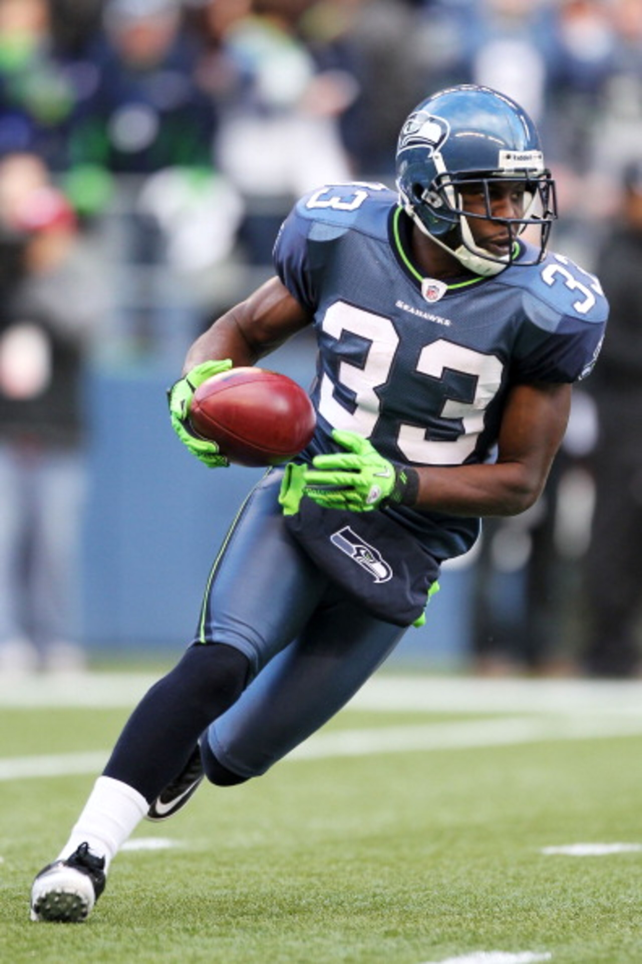 SEATTLE, WA - JANUARY 08:  Leon Washington #33 of the Seattle Seahawks runs down field against the New Orleans Saints during the 2011 NFC wild-card playoff game at Qwest Field on January 8, 2011 in Seattle, Washington.  (Photo by Otto Greule Jr/Getty Imag