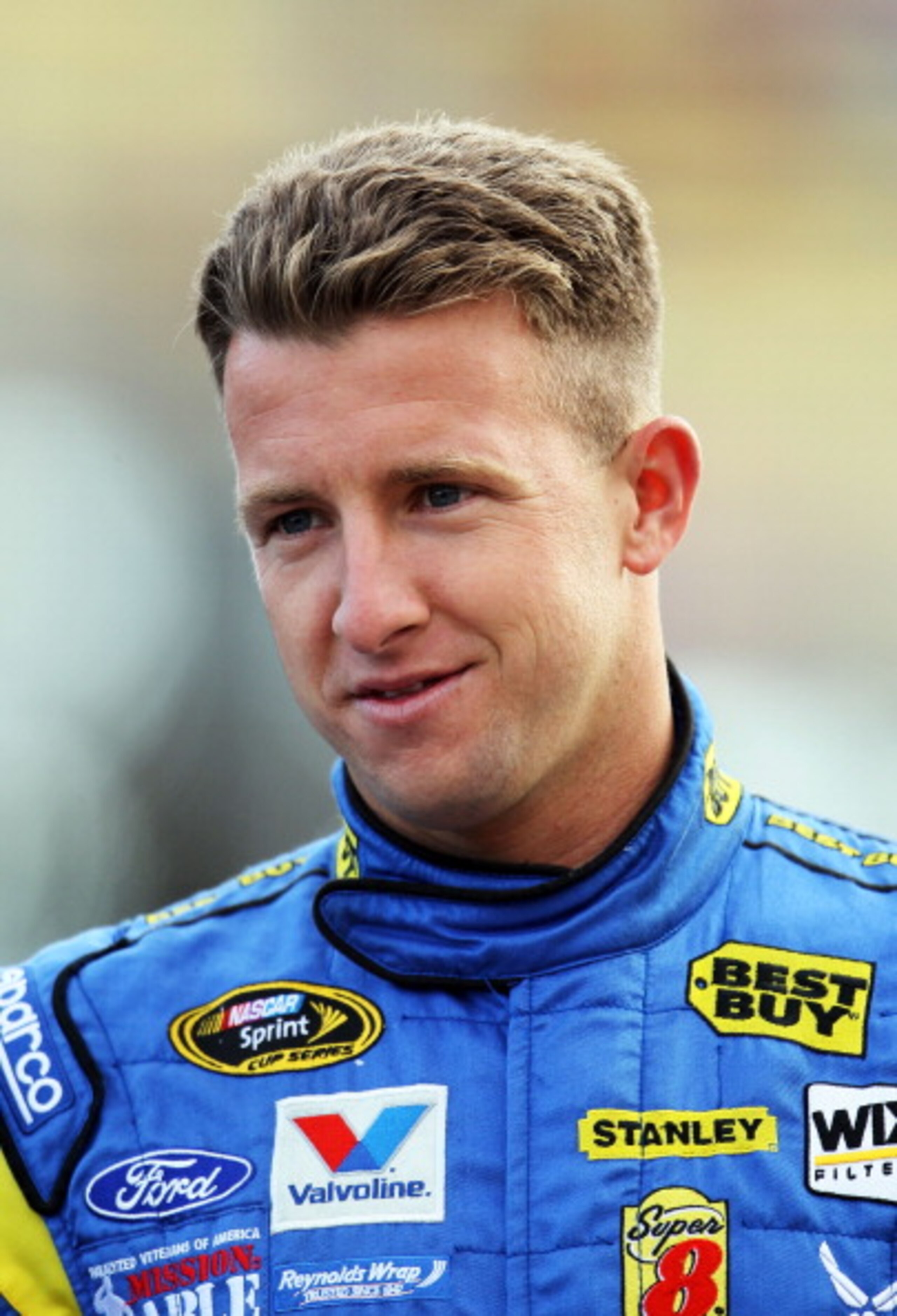 FONTANA, CA - MARCH 25:  AJ Allmendinger, driver of the #43 Best Buy Ford, stands on pit road during qualifying for the NASCAR Sprint Cup Series Auto Club 400 at Auto Club Speedway on March 25, 2011 in Fontana, California.  (Photo by Jeff Gross/Getty Imag