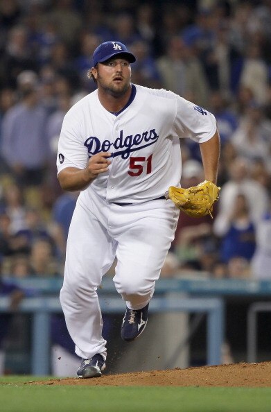 LOS ANGELES, CA - APRIL 01:  Jonathan Broxton #51 of the Los Angeles Dodgers runs to cover first base against the San Francisco Giants at Dodger Stadium on April 1, 2011 in Los Angeles, California.  (Photo by Jeff Gross/Getty Images)
