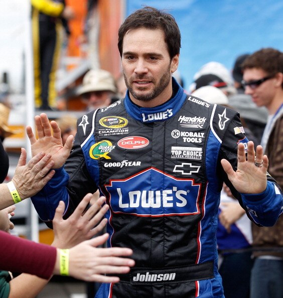 FONTANA, CA - MARCH 27:  Jimmie Johnson, driver of the #48 Lowe's Chevrolet, greets fans during driver introductions for the NASCAR Sprint Cup Series Auto Club 400 at Auto Club Speedway on March 27, 2011 in Fontana, California.  (Photo by Todd Warshaw/Get
