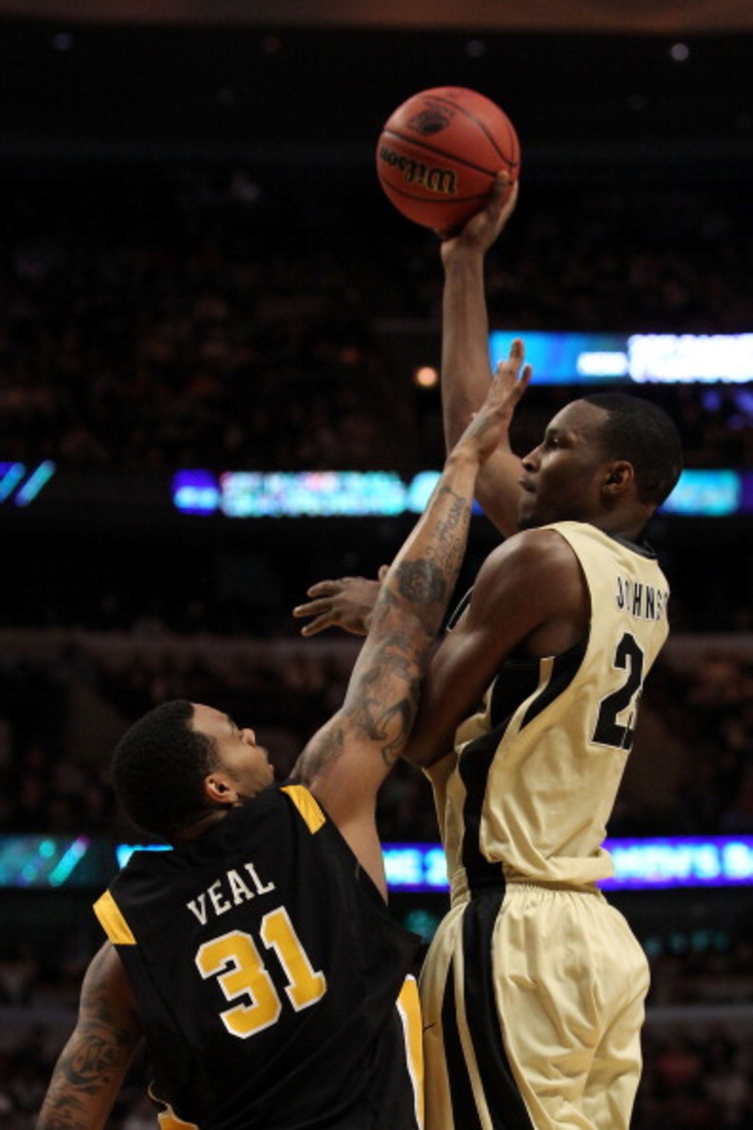 CHICAGO, IL - MARCH 20: JaJuan Johnson #25 of the Purdue Boilermakers shoots against Toby Veal #31 of the Virginia Commonwealth Rams in the first half during the third round of the 2011 NCAA men's basketball tournament at the United Center on March 20, 2 CHICAGO, IL - MARCH 20: JaJuan Johnson #25 of the Purdue Boilermakers shoots against Toby Veal #31 of the Virginia Commonwealth Rams in the first half during the third round of the 2011 NCAA men's basketball tournament at the United Center on March 20, 2