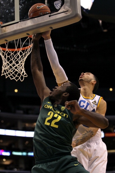 LOS ANGELES, CA - MARCH 10:  Teondre Williams #22 of the Oregon Ducks lays the ball up in front of Tyler Honeycutt #23 of the UCLA Bruins in the first half in the quarterfinals of the 2011 Pacific Life Pac-10 Men's Basketball Tournament at Staples Center