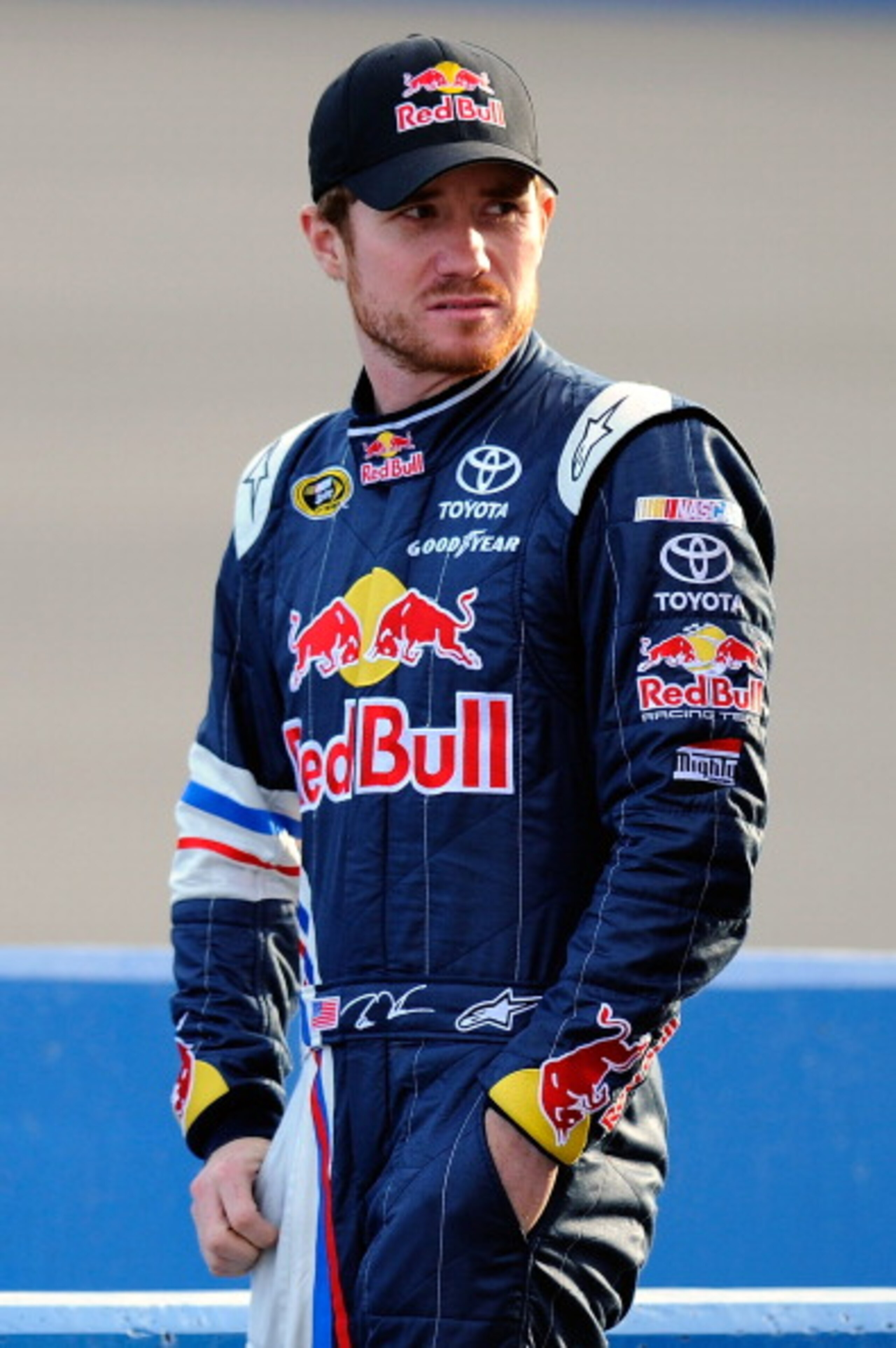 FONTANA, CA - MARCH 25:  Brian Vickers, driver of the #83 Red Bull Toyota, stands on pit road during qualifying for the NASCAR Sprint Cup Series Auto Club 400 at Auto Club Speedway on March 25, 2011 in Fontana, California.  (Photo by Jared C. Tilton/Getty
