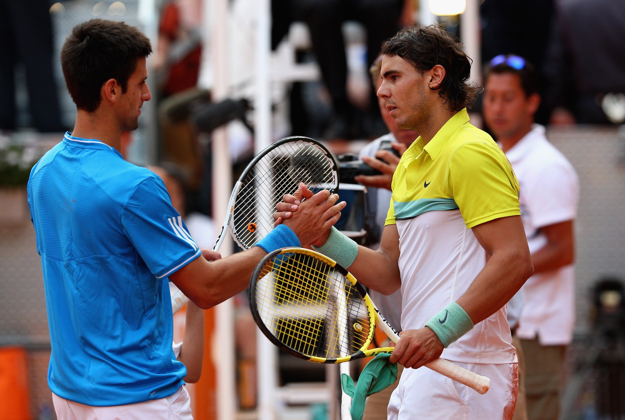 MADRID, SPAIN - MAY 16:  Rafael Nadal of Spain shakes hands at the net after his three set victory against Novak Djokovic of Serbia in their semi-final during the Madrid Open tennis tournament at the Caja Magica on May 16, 2009 in Madrid, Spain.  (Photo b