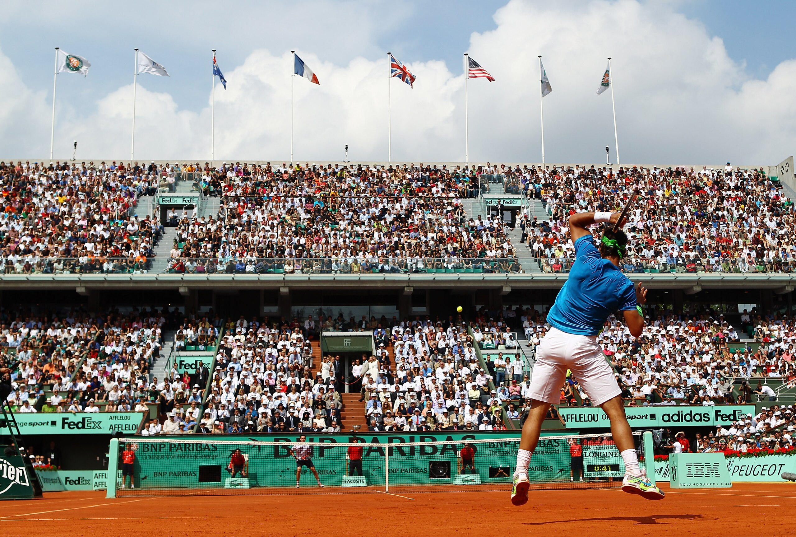 PARIS - JUNE 06:  Rafael Nadal of Spain plays a forehand during the men's singles final match between Rafael Nadal of Spain and Robin Soderling of Sweden on day fifteen of the French Open at Roland Garros on June 6, 2010 in Paris, France.  (Photo by Julia