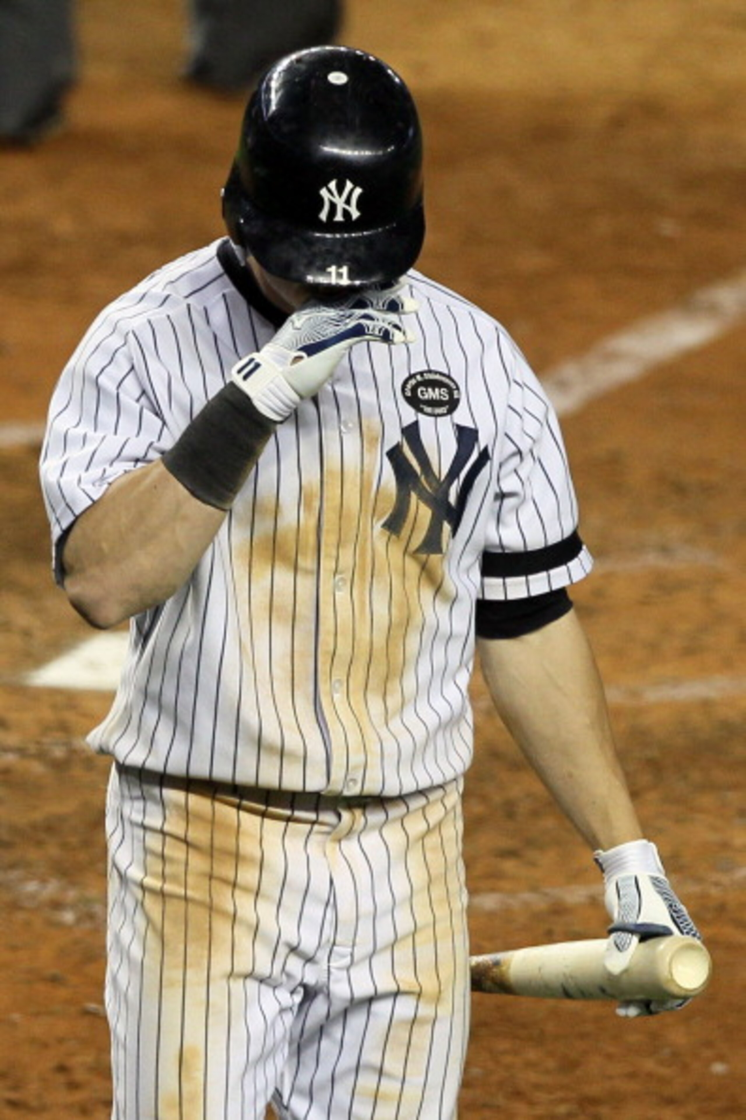 NEW YORK - OCTOBER 18:  Brett Gardner #11 of the New York Yankees reacts after striking out against the Texas Rangers in Game Three of the ALCS during the 2010 MLB Playoffs at Yankee Stadium on October 18, 2010 in New York, New York.  (Photo by Jim McIsaa