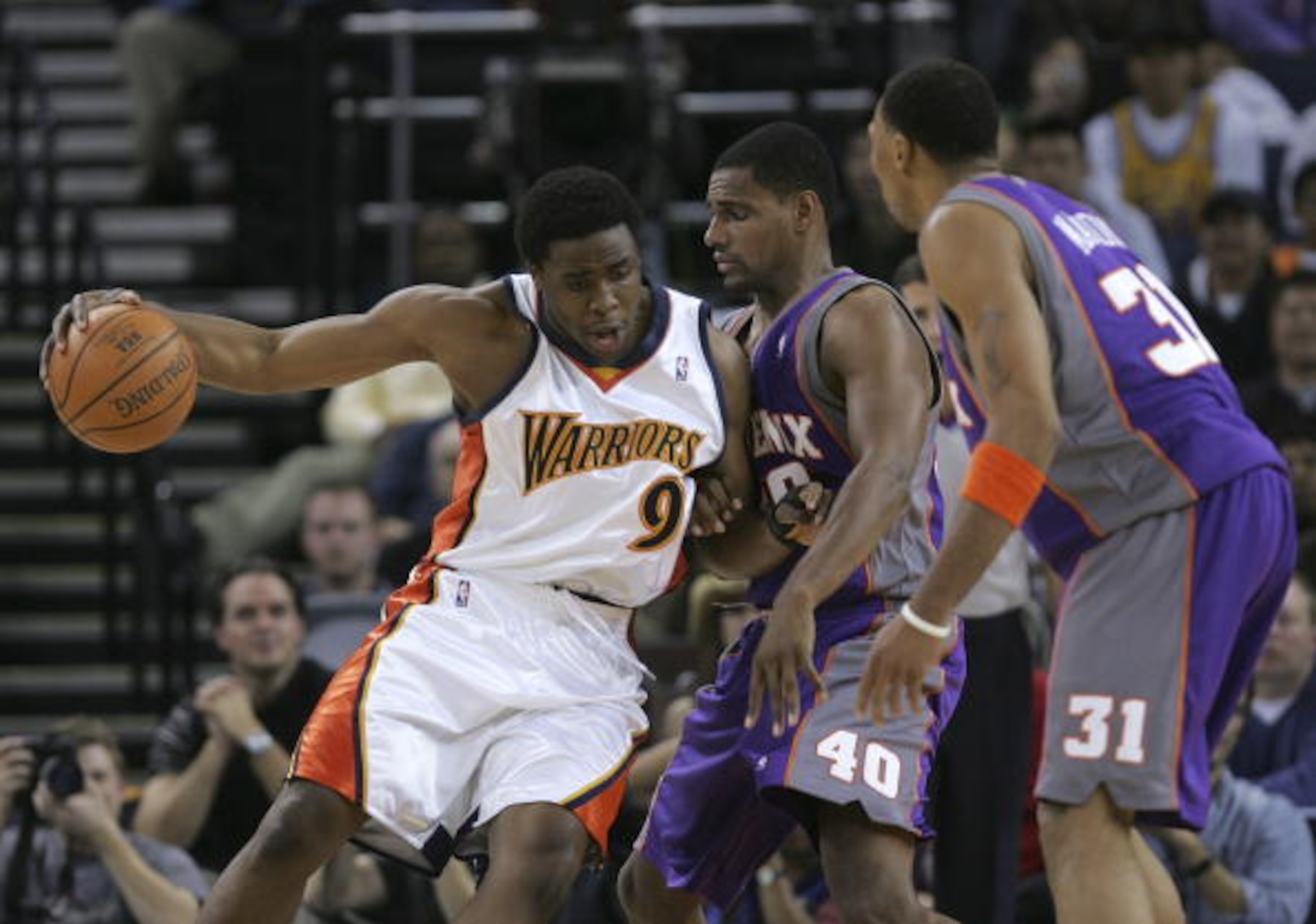 OAKLAND, CA - DECEMBER 07: Ike Diogu #9 of the Golden State Warriors drives the ball as Kurt Thomas #40 and Shawn Marion #31 of the Phoenix Suns defend on December 7, 2005 at the Arena in Oakland, California. NOTE TO USER: User expressly acknowledges and OAKLAND, CA - DECEMBER 07: Ike Diogu #9 of the Golden State Warriors drives the ball as Kurt Thomas #40 and Shawn Marion #31 of the Phoenix Suns defend on December 7, 2005 at the Arena in Oakland, California. NOTE TO USER: User expressly acknowledges and