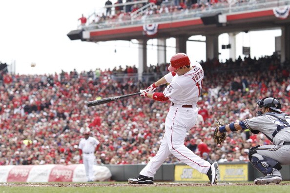 CINCINNATI, OH - MARCH 31: Joey Votto #19 of the Cincinnati Reds hits a sacrifice fly in the first inning against the Milwaukee Brewers in the opening day game at Great American Ballpark on March 31, 2011 in Cincinnati, Ohio. The Reds won 7-6. (Photo by J CINCINNATI, OH - MARCH 31: Joey Votto #19 of the Cincinnati Reds hits a sacrifice fly in the first inning against the Milwaukee Brewers in the opening day game at Great American Ballpark on March 31, 2011 in Cincinnati, Ohio. The Reds won 7-6. (Photo by J