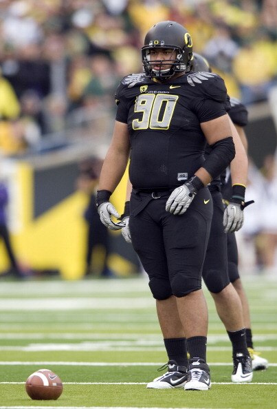 EUGENE, OR - NOVEMBER 06: Defensive tackle Ricky Heimuli #90 of the Oregon Ducks stands at the line of scrimmage in the first quarter of the game against the Washington Huskies at Autzen Stadium on November 6, 2010 in Eugene, Oregon. The Ducks won the gam