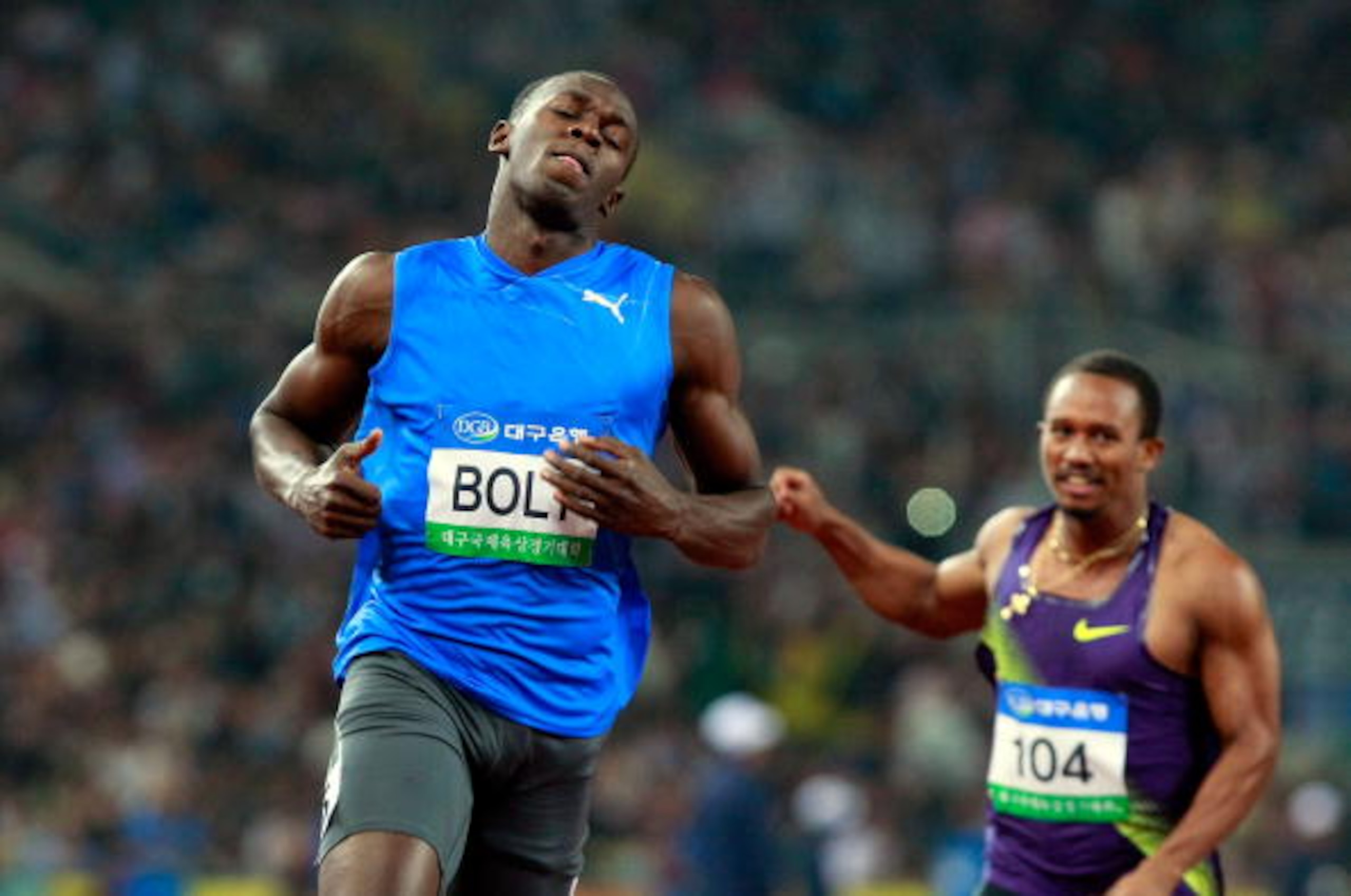 DAEGU, SOUTH KOREA - MAY 19: Usain Bolt of Jamaica celebrates after crossing the finish line of the men's 100 metres during the Colorful Daegu Pre-Championships Meeting 2010 at Daegu Stadium on May 19, 2010 in Daegu, South Korea. Bolt won the race at 9.86
