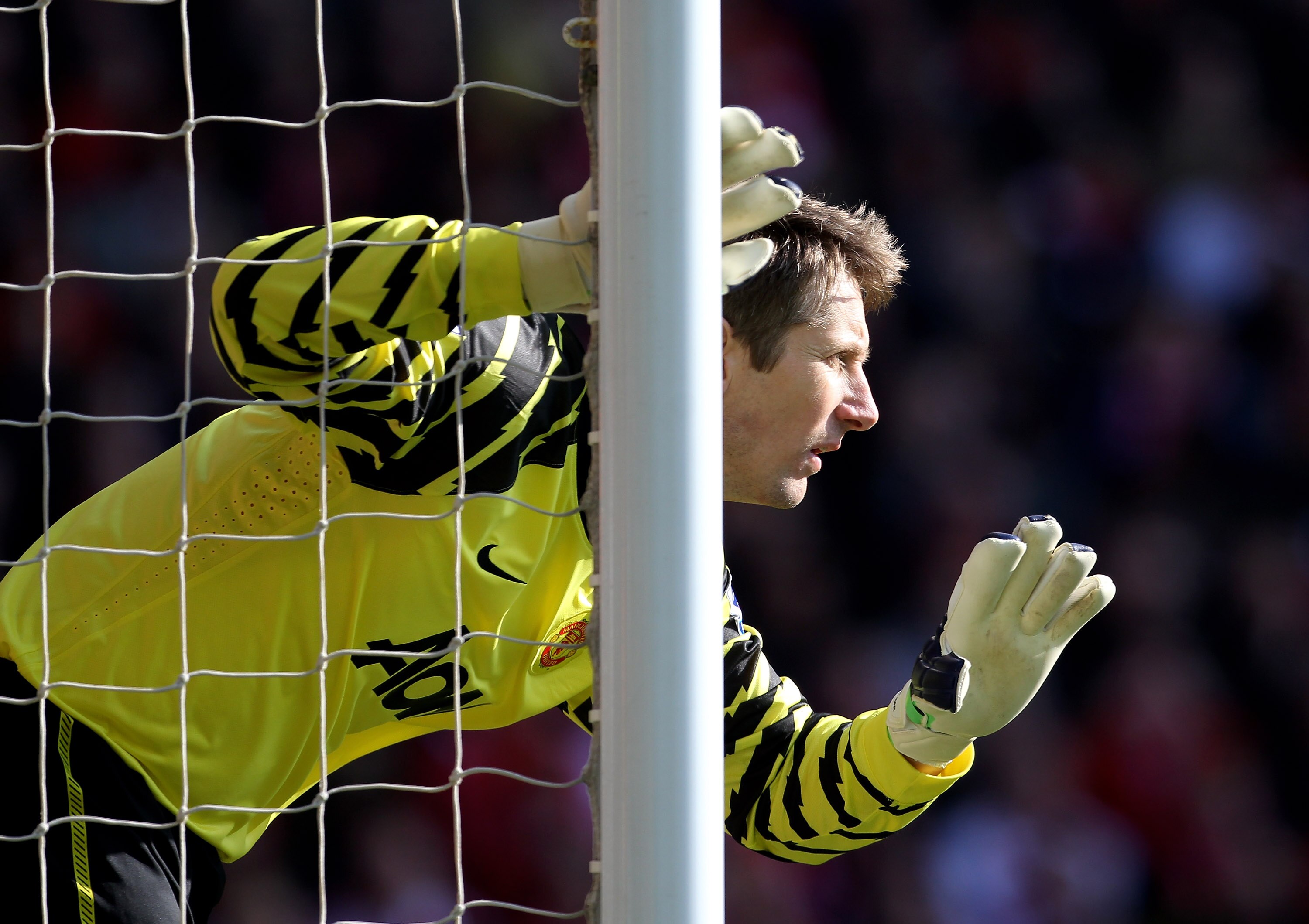 LIVERPOOL, ENGLAND - MARCH 06:  Edwin van der Sar of Manchester United gestures during the Barclays Premier League match between Liverpool and Manchester United at Anfield on March 6, 2011 in Liverpool, England.  (Photo by Alex Livesey/Getty Images)