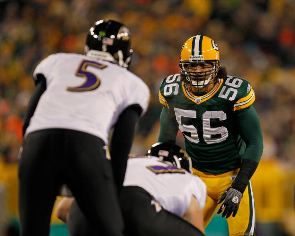 GREEN BAY, WI - DECEMBER 07: Nick Barnett #56 of the Green Bay Packers stares at Joe Flacco #5 of the Baltimore Ravens before the snap at Lambeau Field on December 7, 2009 in Green Bay, Wisconsin. The Packers defeated the Ravens 27-17. (Photo by Jonathan