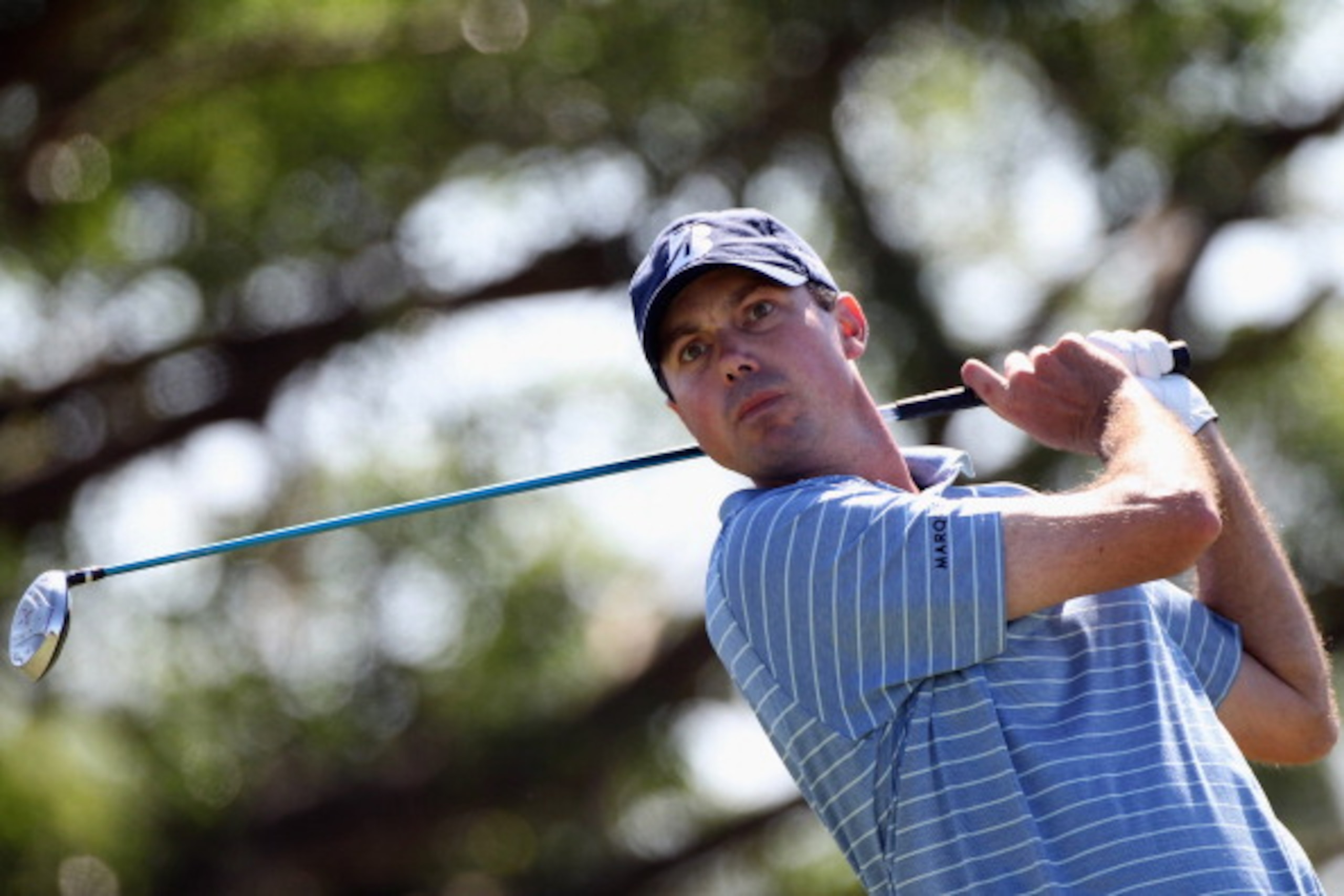 DORAL, FL - MARCH 13:  Matt Kuchar hits a shot during the final round of the 2011 WGC- Cadillac Championship at the TPC Blue Monster at the Doral Golf Resort and Spa on March 13, 2011 in Doral, Florida.  (Photo by Sam Greenwood/Getty Images)