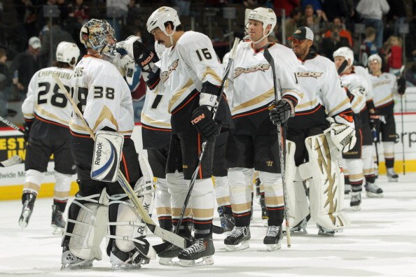 DENVER, CO - MARCH 11:  Goalie Dan Ellis #38 of the Anaheim Ducks celebrates with George Parros #16 and their teammates after their victory over the Colorado Avalanche during NHL action at the Pepsi Center on March 11, 2011 in Denver, Colorado. Ellis earn