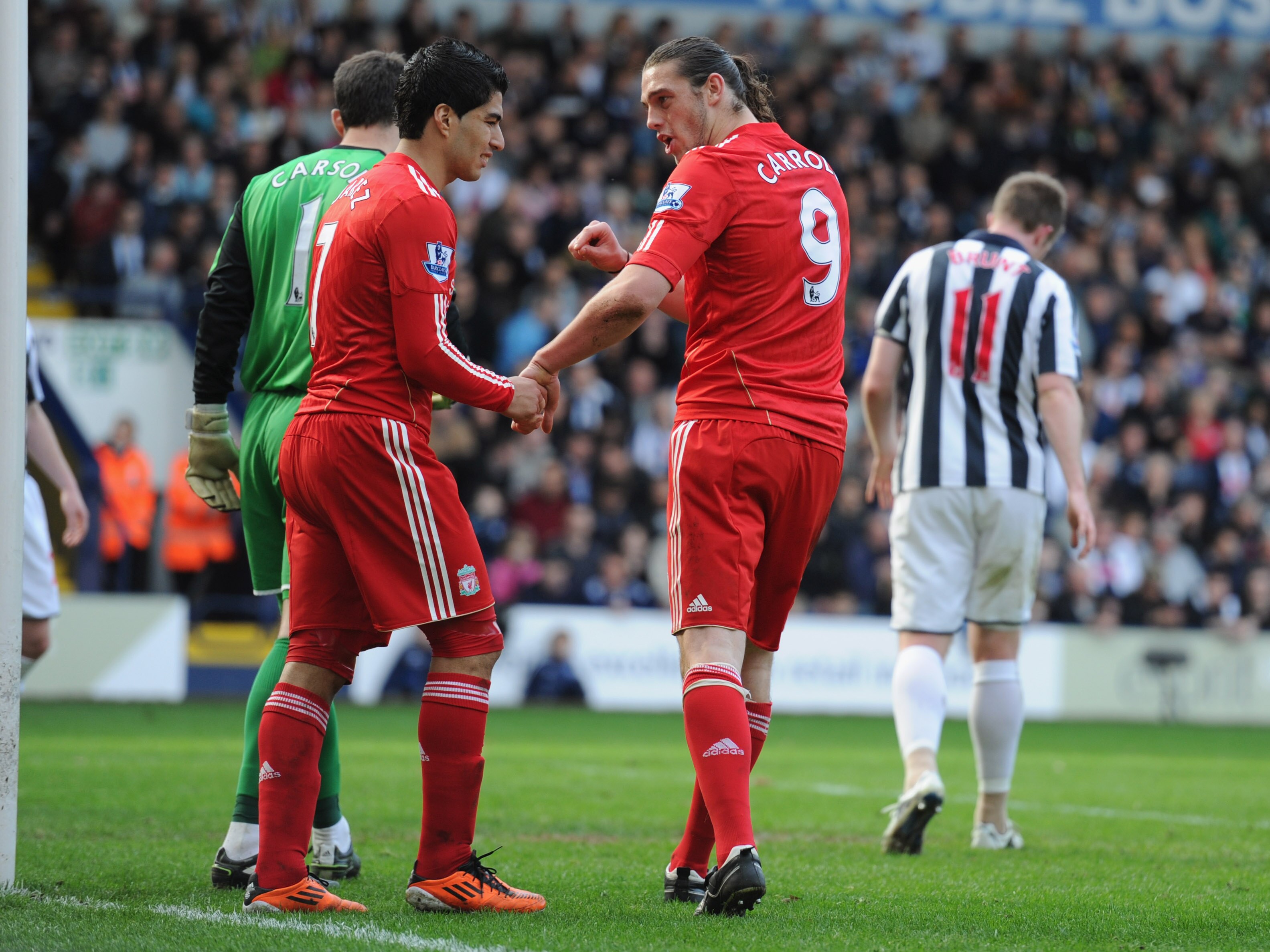 WEST BROMWICH, ENGLAND - APRIL 02: Andy Carroll and Luis Suarez of Liverpool look dejected after a missed chance during the Barclays Premier League match between West Bromwich Albion and Liverpool at The Hawthorns on April 2, 2011 in West Bromwich, Englan