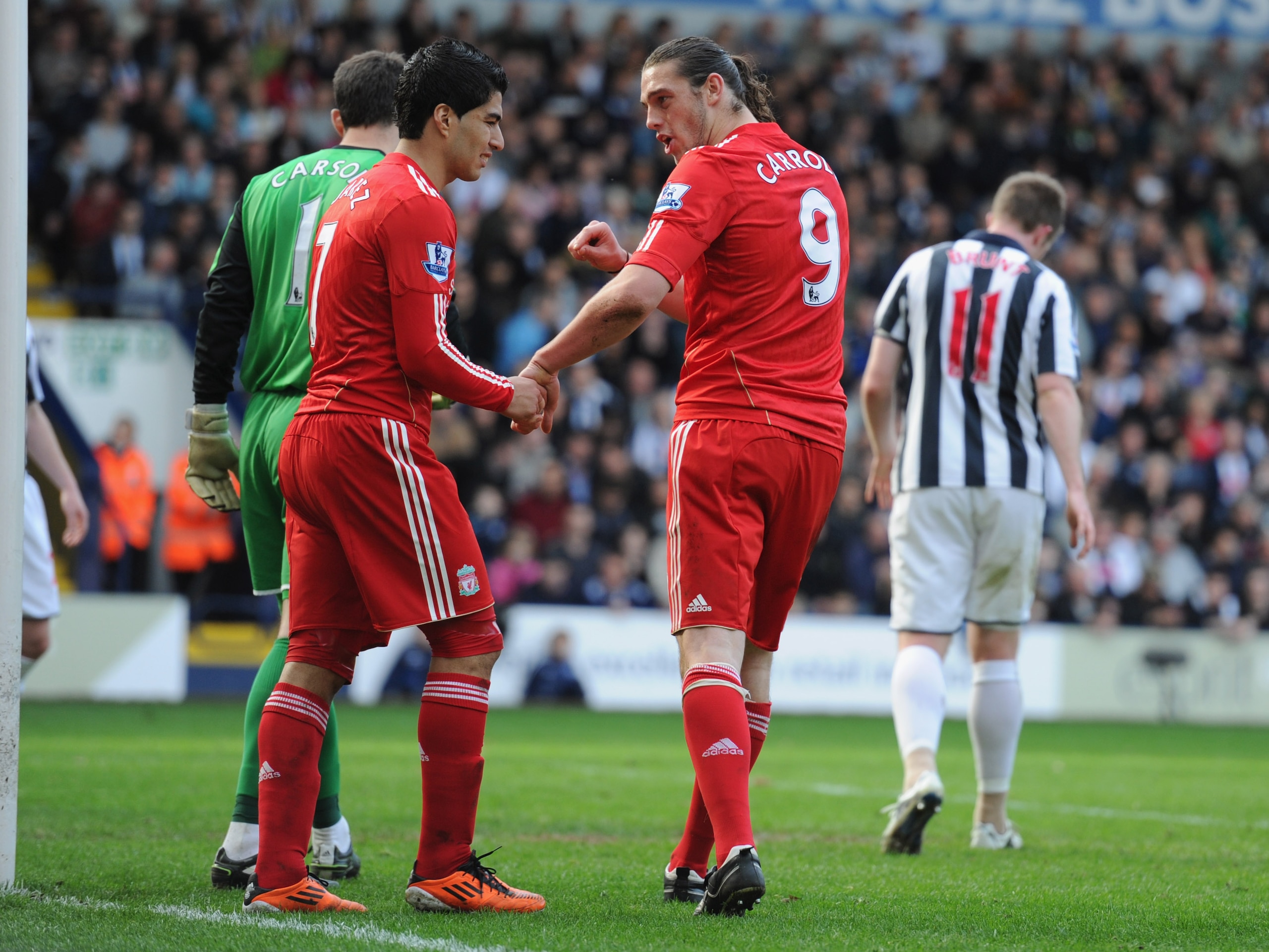 WEST BROMWICH, ENGLAND - APRIL 02: Andy Carroll and Luis Suarez of Liverpool look dejected after a missed chance during the Barclays Premier League match between West Bromwich Albion and Liverpool at The Hawthorns on April 2, 2011 in West Bromwich, Englan