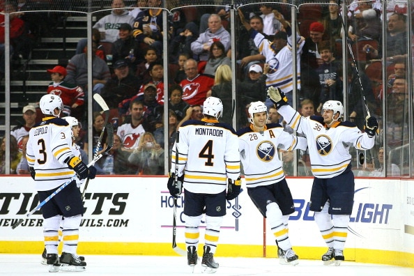 NEWARK, NJ - OCTOBER 23:  Patrick Kaleta #36 of the Buffalo Sabres (R) celebrates with teammates after scoring against the New Jersey Devils in the second period on October 23, 2010 at the Prudential Center in Newark, New Jersey.  (Photo by Andrew Burton/